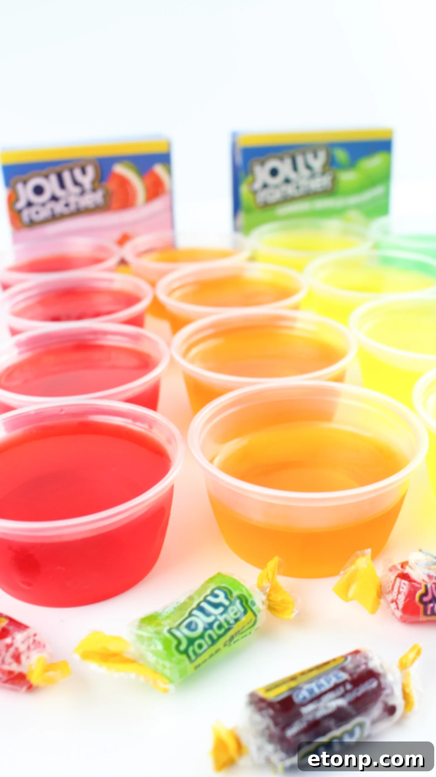 A close-up of a tray of neatly arranged Jello Shots, emphasizing their uniform and appealing appearance