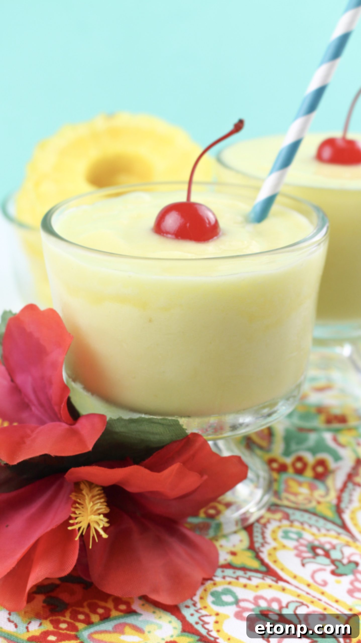 A refreshing Dole Pineapple Whip garnished with a fresh pineapple wedge