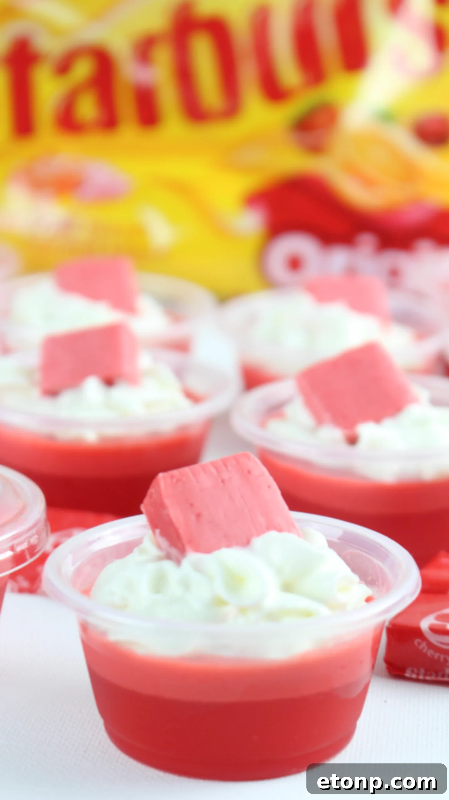 Cherry Starburst Jiggle Pops 11 Final presentation of a Cherry Starburst JELL-O Shot, perfectly garnished and ready to be enjoyed, representing the culmination of the recipe.