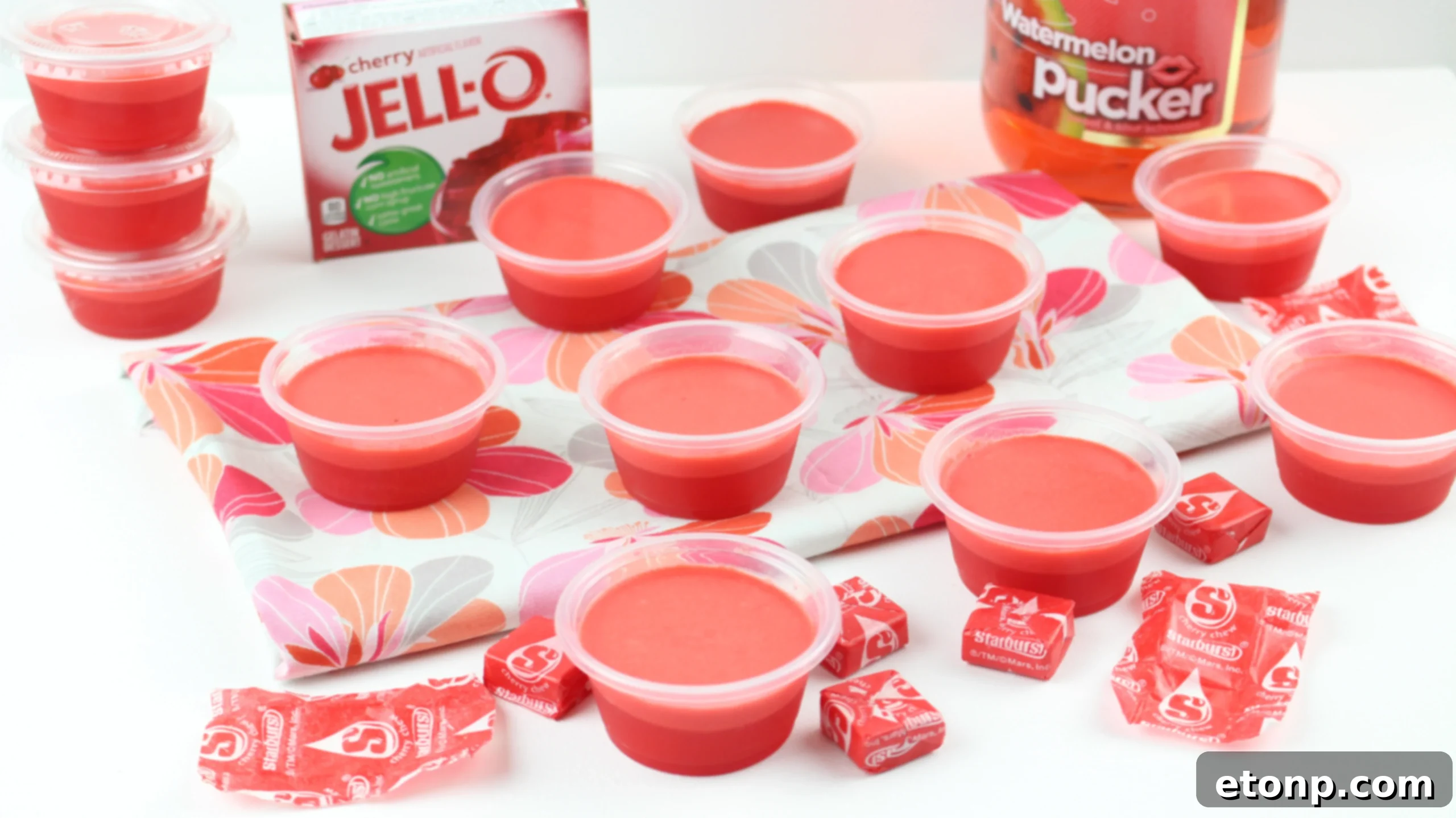 Cherry Starburst Jiggle Pops 6 Assorted JELL-O shots in various colors, including the red Cherry Starburst, displayed together to showcase the range and appeal of the collection.