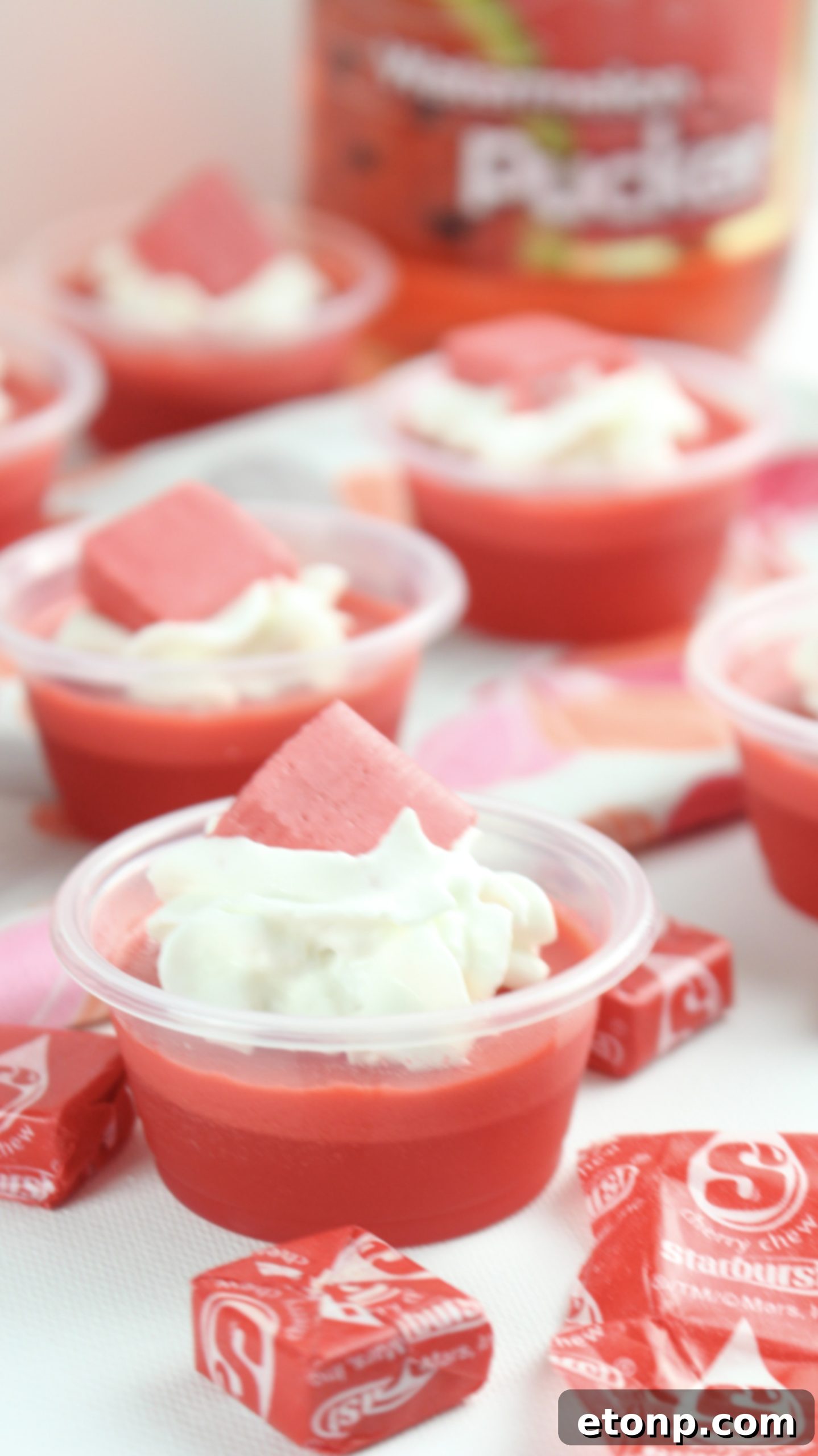 Cherry Starburst Jiggle Pops 7 A vibrant assortment of JELL-O shots in different colors and garnishes, including the iconic red Cherry Starburst, showcasing the creativity of the recipe series.