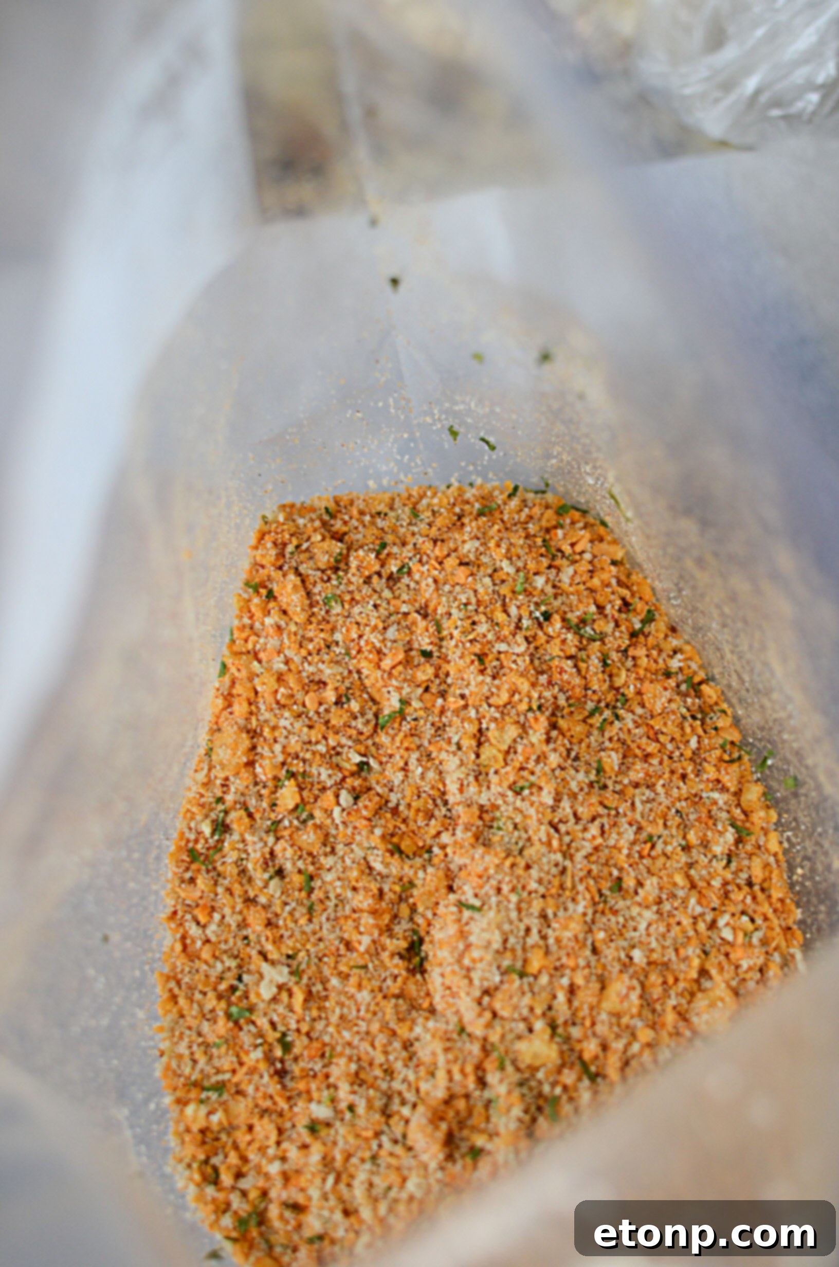 Two pieces of perfectly cooked Taco Fried Chicken, showcasing its golden, textured crust