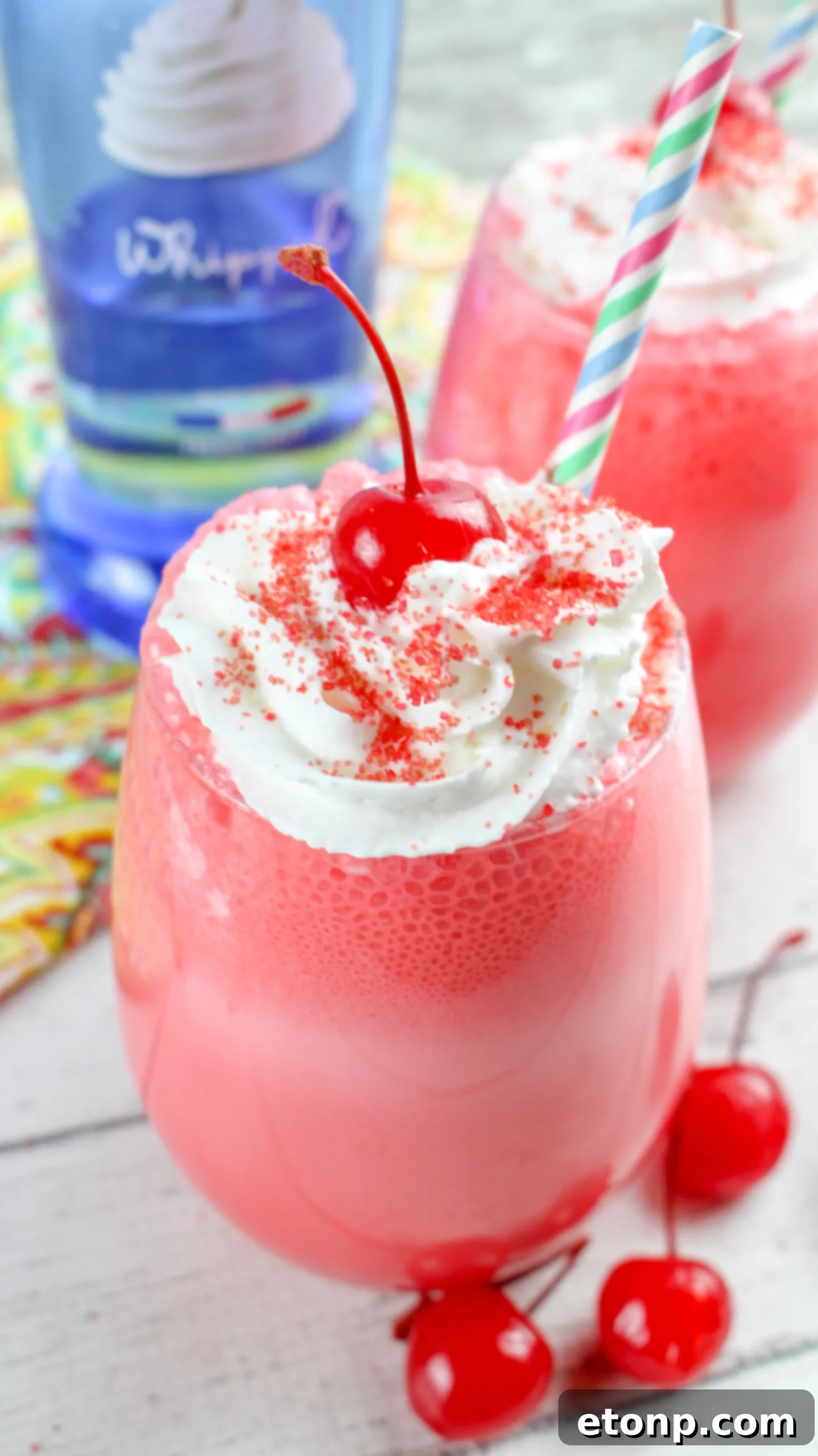 Delicious Boozy Italian Cherry Ice Cream Soda topped with whipped cream and a cherry