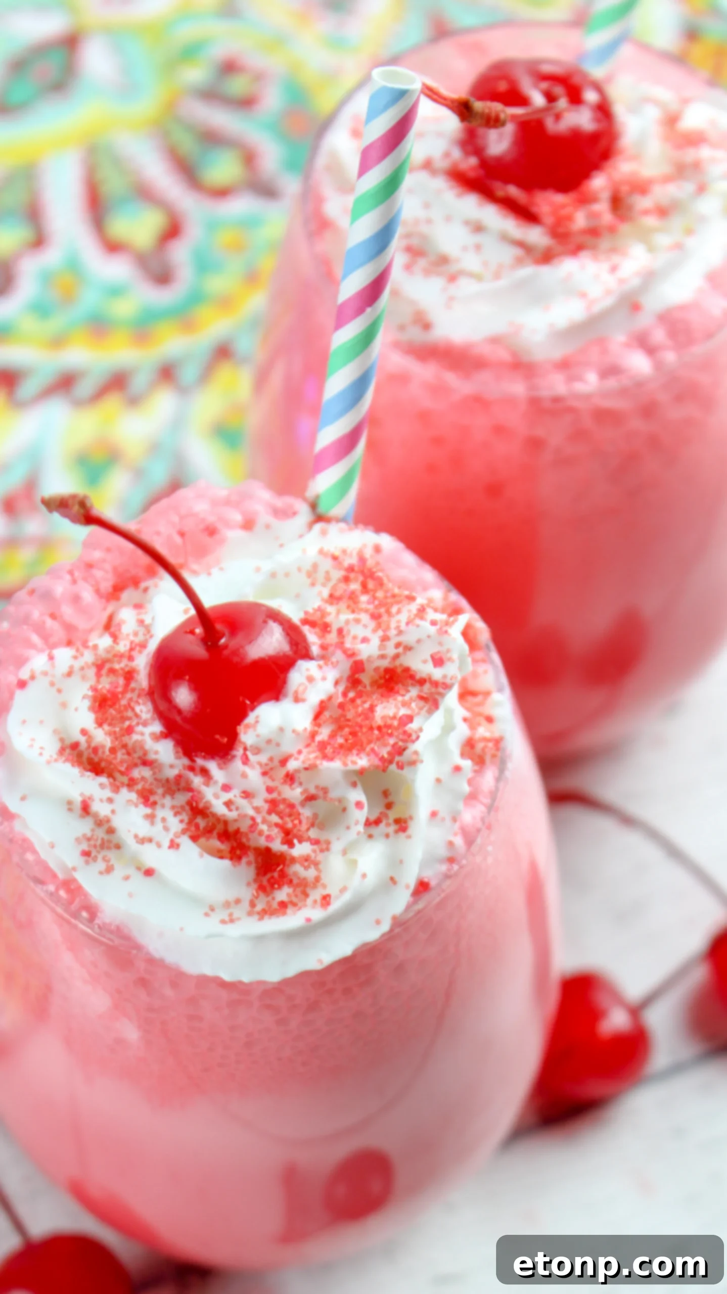 Boozy Italian Cherry Ice Cream Soda in a glass with garnishes