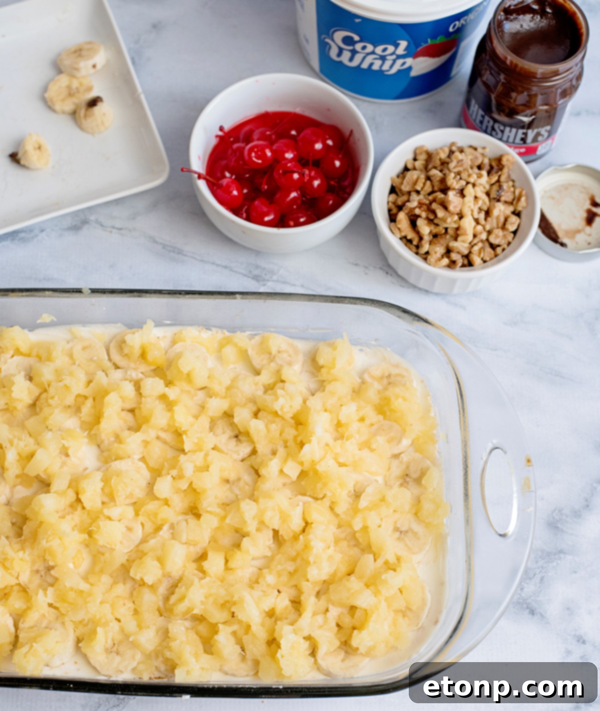 A whole No-Bake Banana Split Dessert in a baking dish, ready to be served