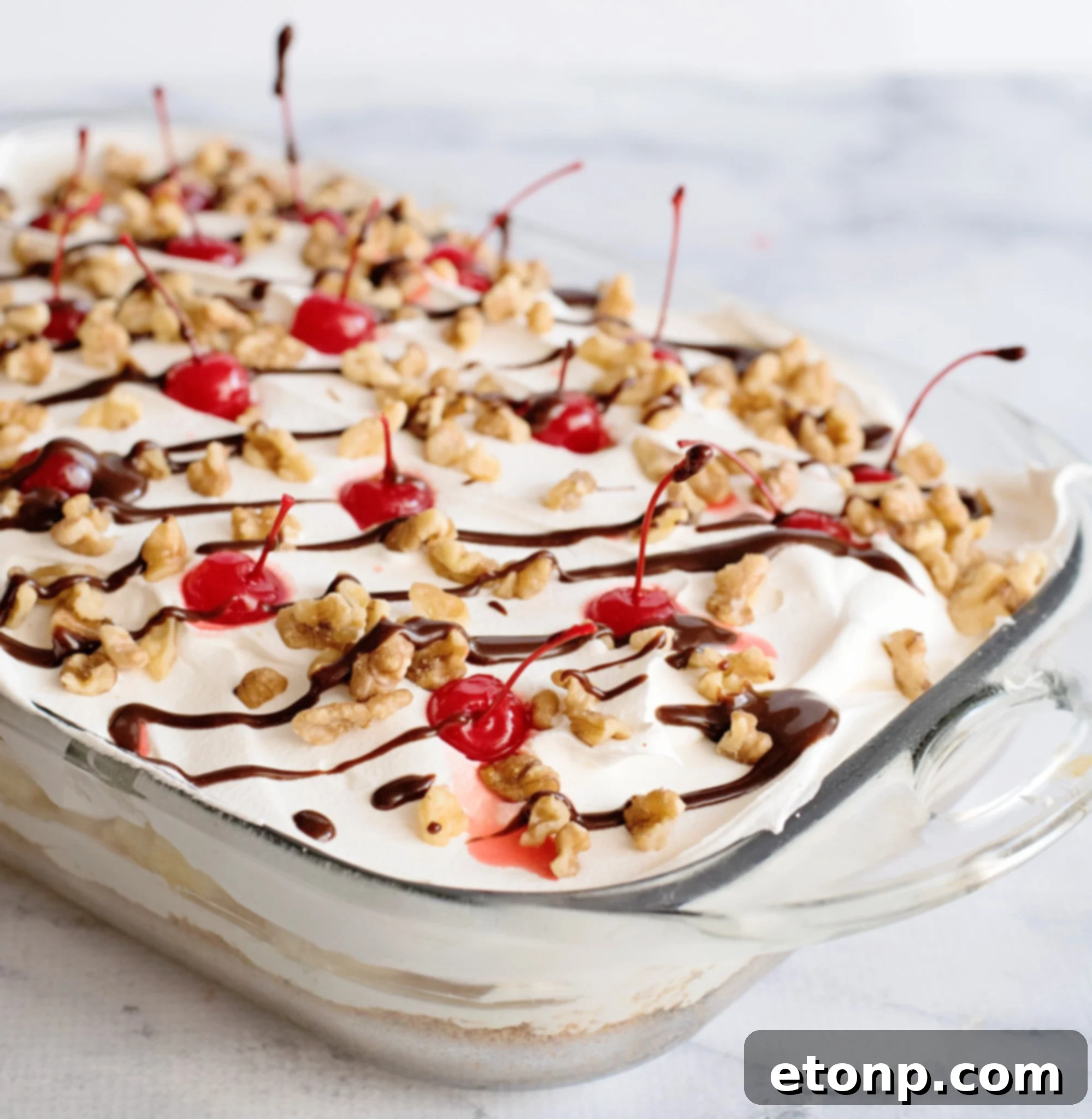 No-Bake Banana Split Dessert served outdoors on a picnic table