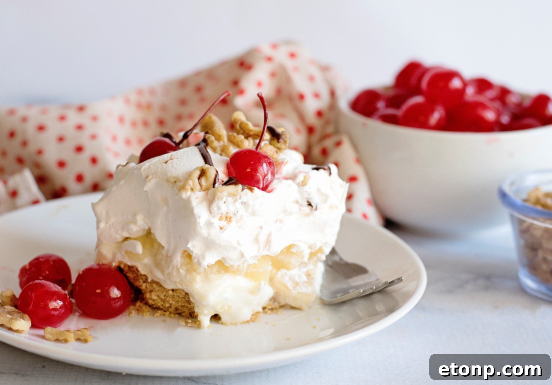 A wider shot of the No-Bake Banana Split Dessert, highlighting its vibrant colors