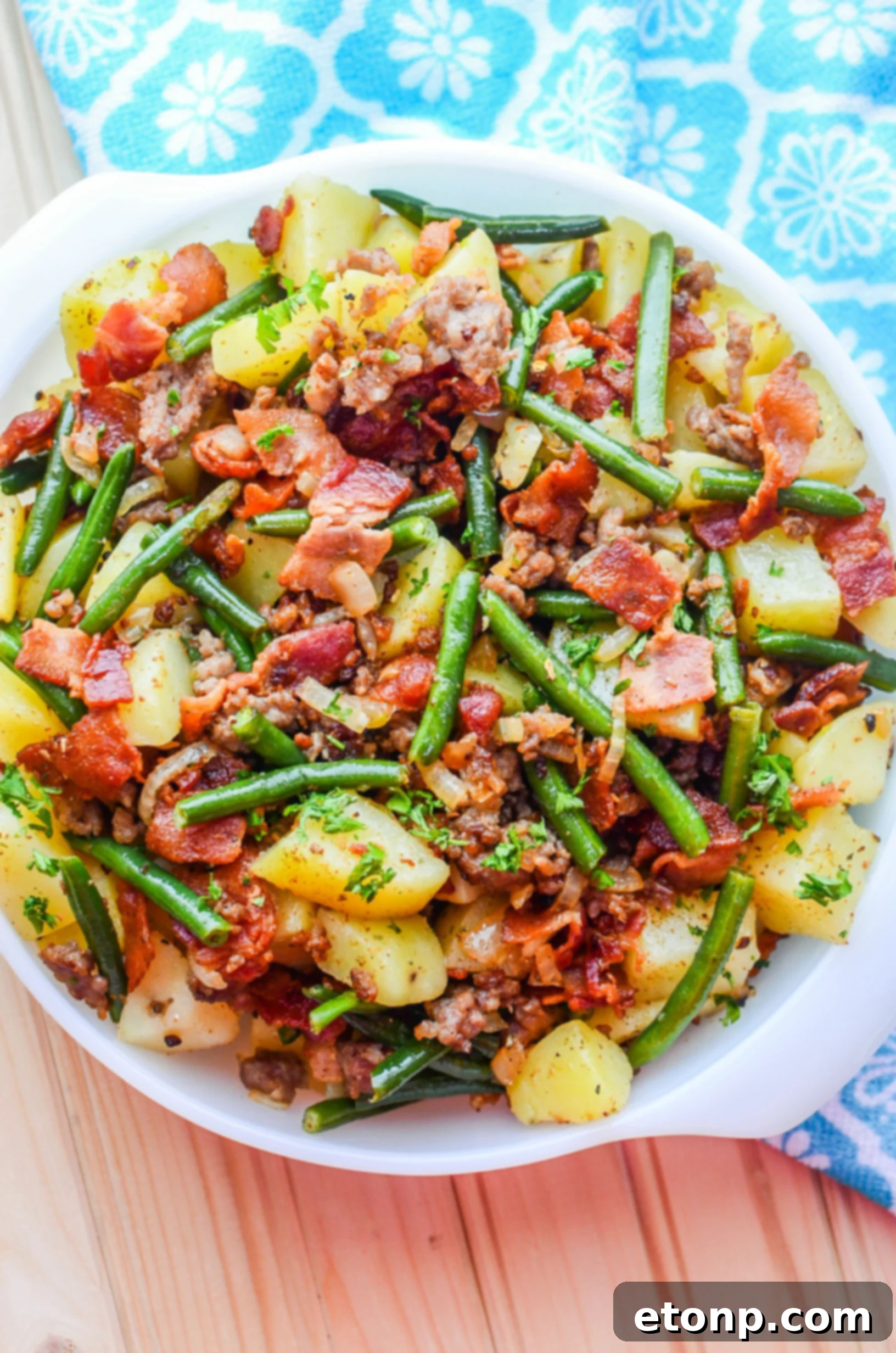 Hearty Southern Sausage, Potatoes, and Green Beans dish with thick-cut bacon