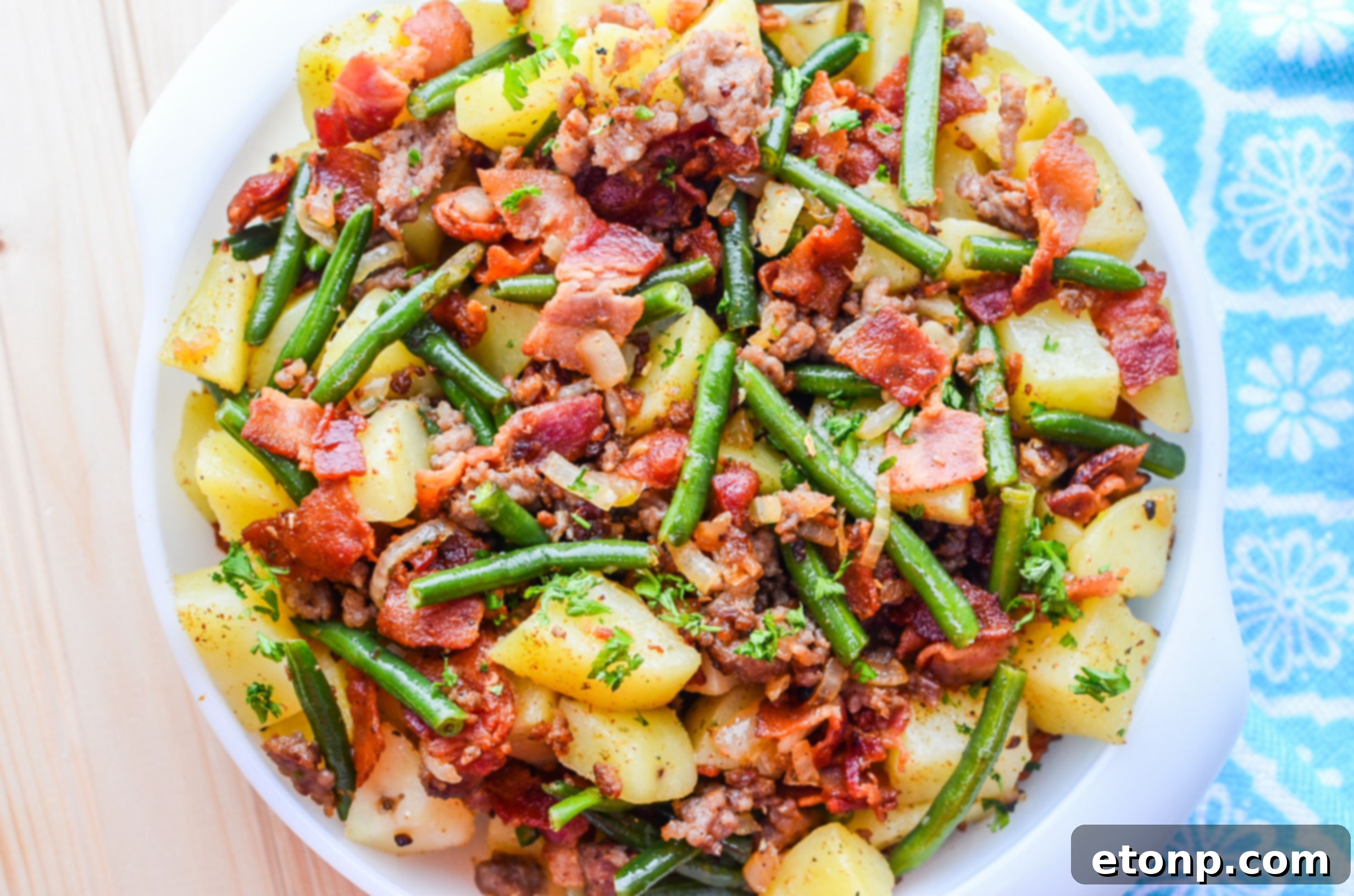 Cooked Southern Sausage, Potatoes, and Green Beans in a large skillet