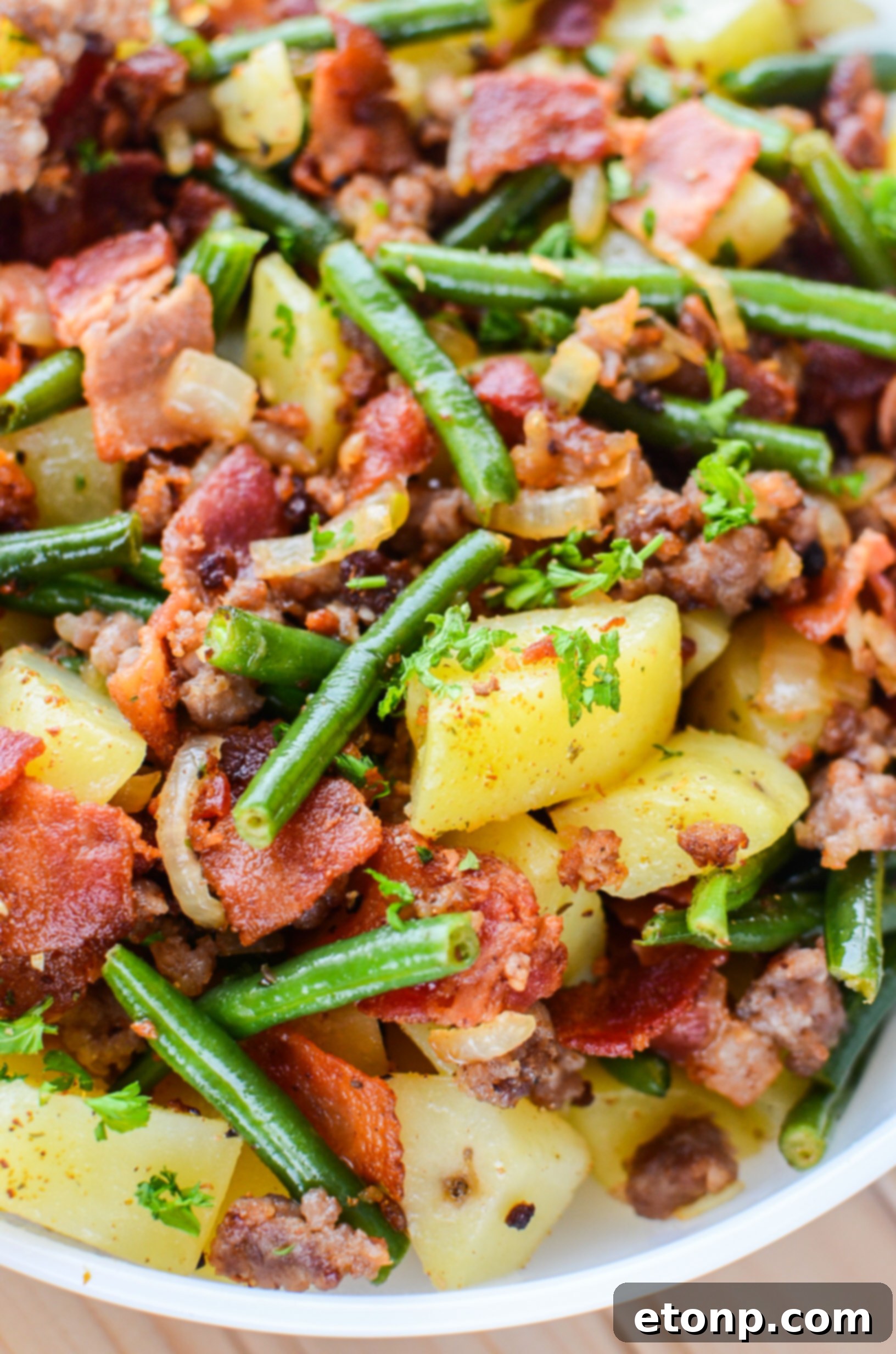 Platter of Southern Sausage, Potatoes, and Green Beans alongside other dishes