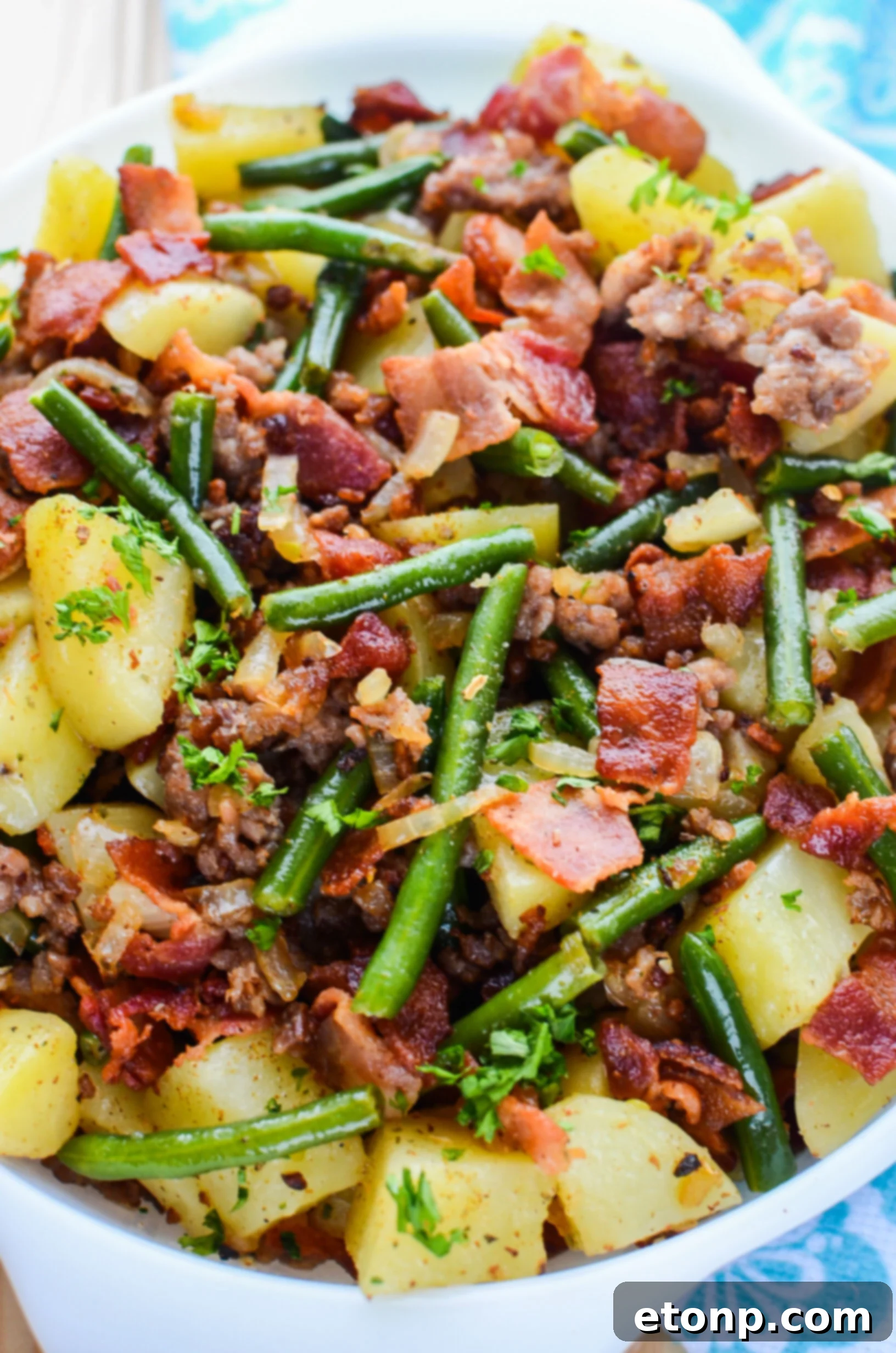 A hearty helping of Southern Sausage, Potatoes, and Green Beans in a bowl