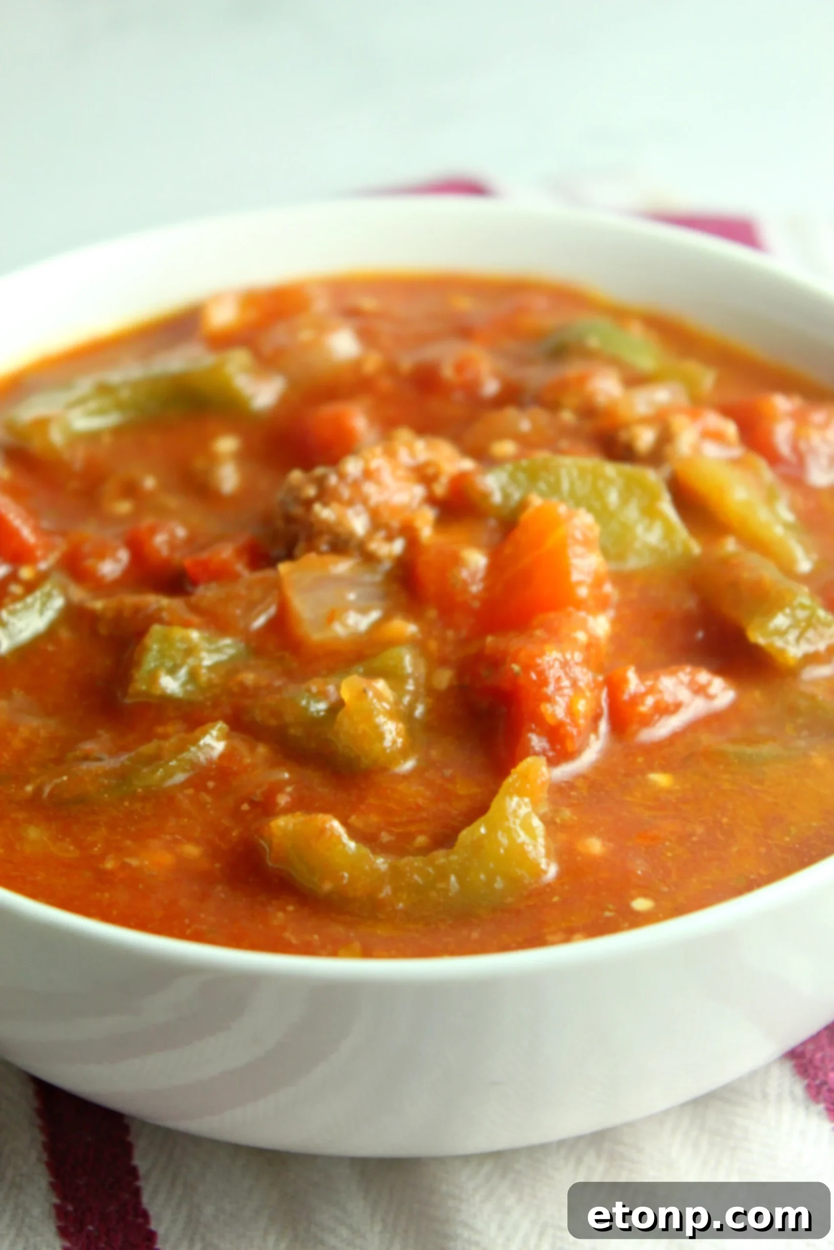 Homestyle Stuffed Pepper Stew 3 Close-up of hearty stuffed pepper soup, highlighting the rich tomato broth, tender ground beef, and diced bell peppers.