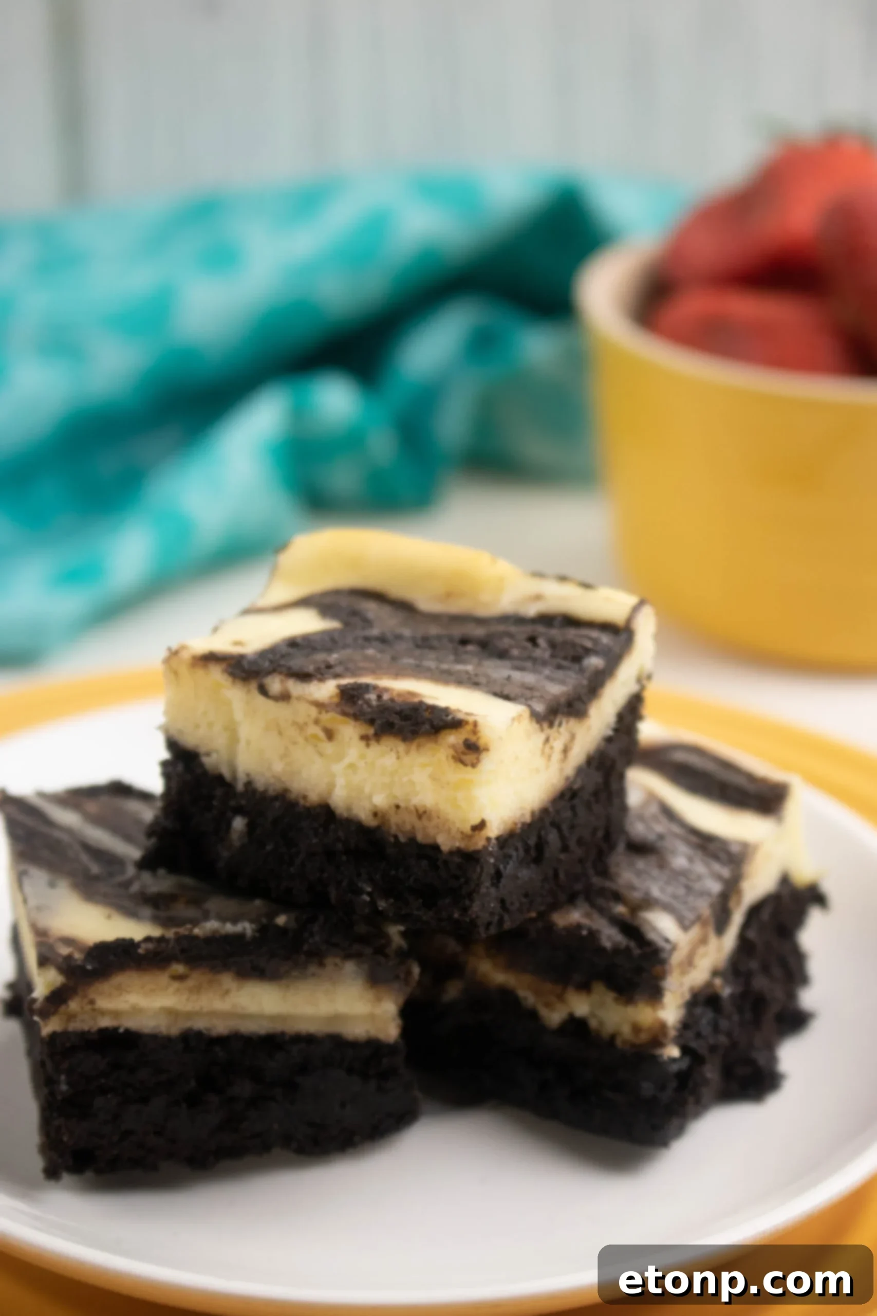 Homemade Cheesecake Swirl Brownies 5 A close-up shot of a single cheesecake swirl brownie piece, showing its fudgy interior and the distinct cream cheese swirl.