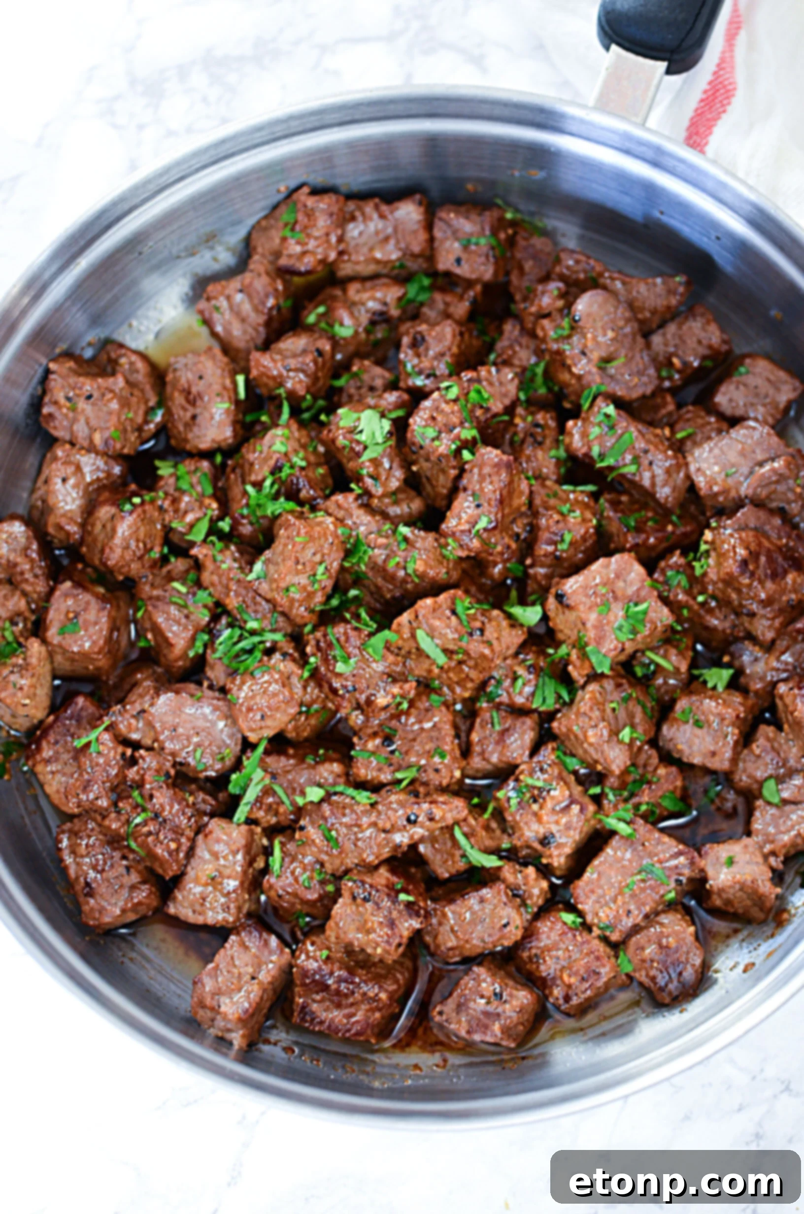 A family-style platter of garlic butter steak bites, ready to be enjoyed.