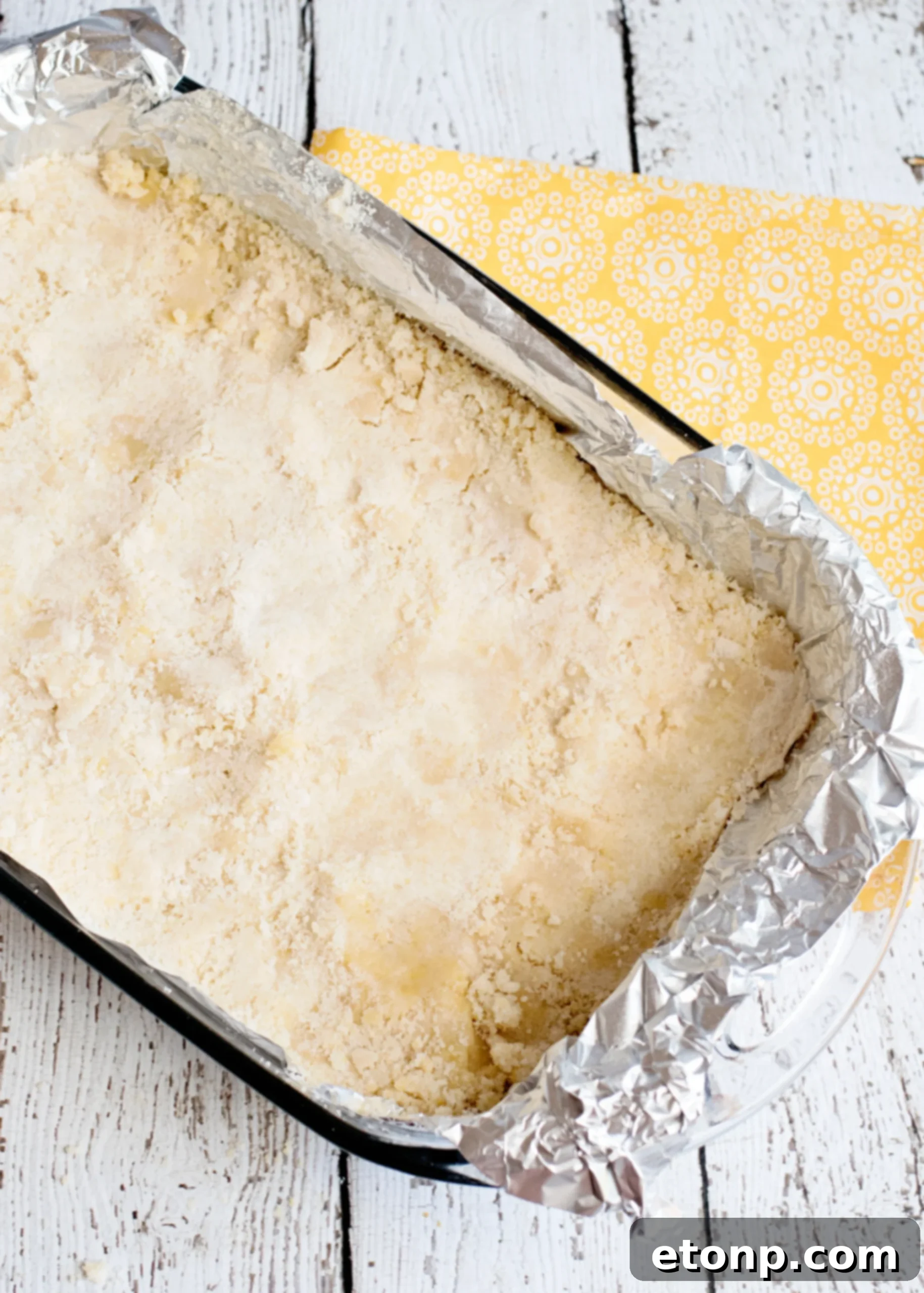 Close-up of a single Ooey Gooey Butter Bar, showcasing its soft, rich texture.