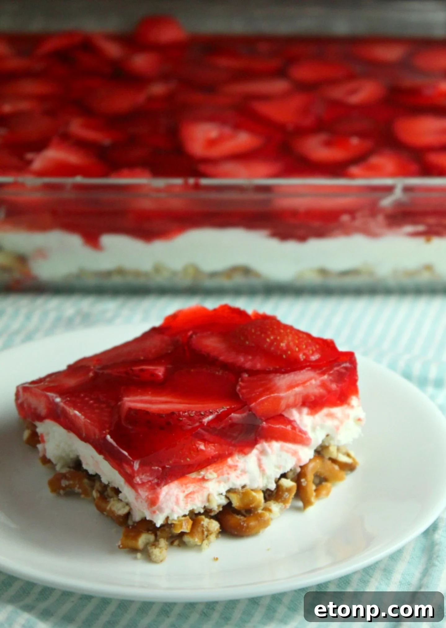A close-up shot of the pretzel crust layer of the Strawberry Pretzel Salad before the filling is added.