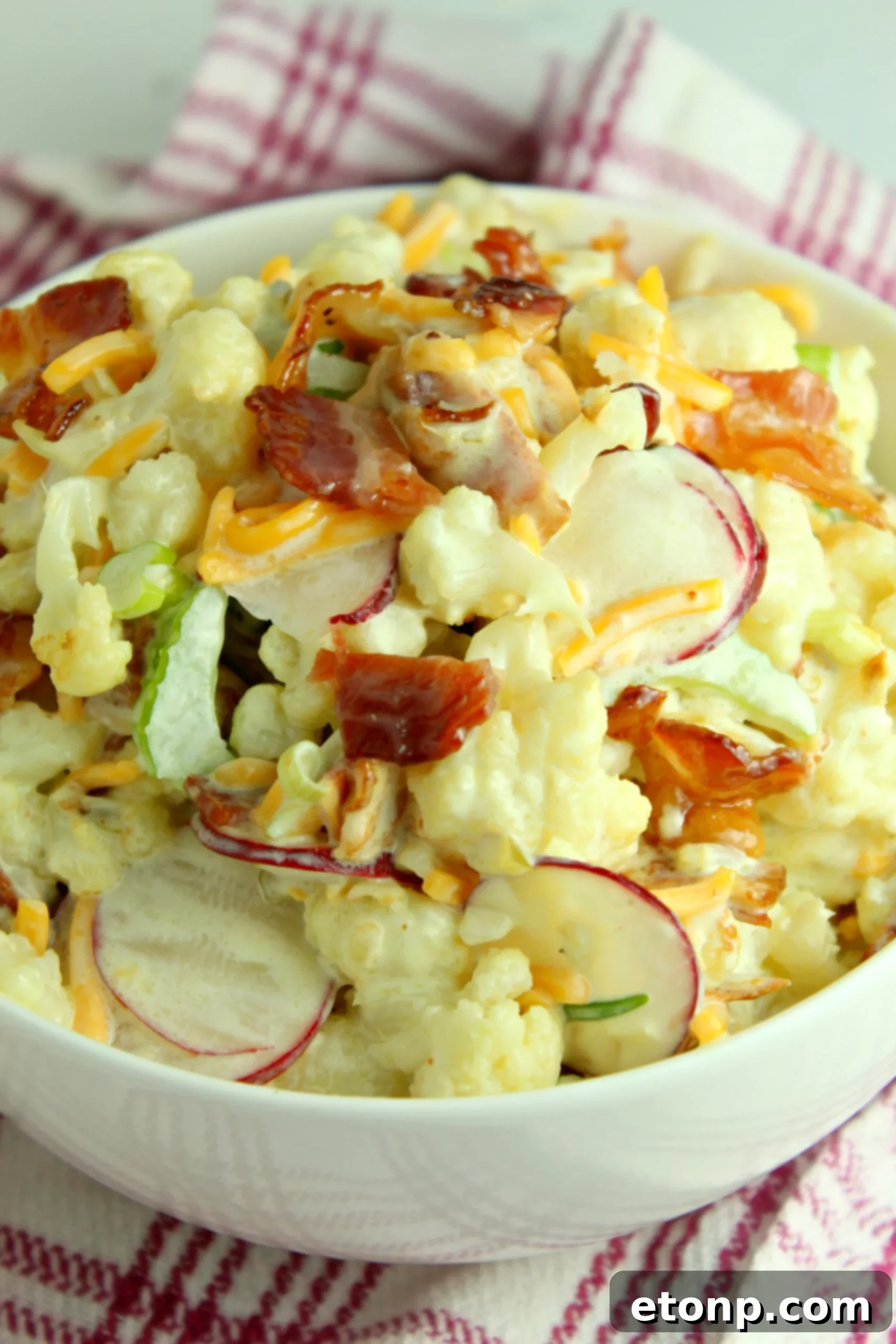 Delicious Loaded Cauliflower Salad with crispy bacon and melted cheese