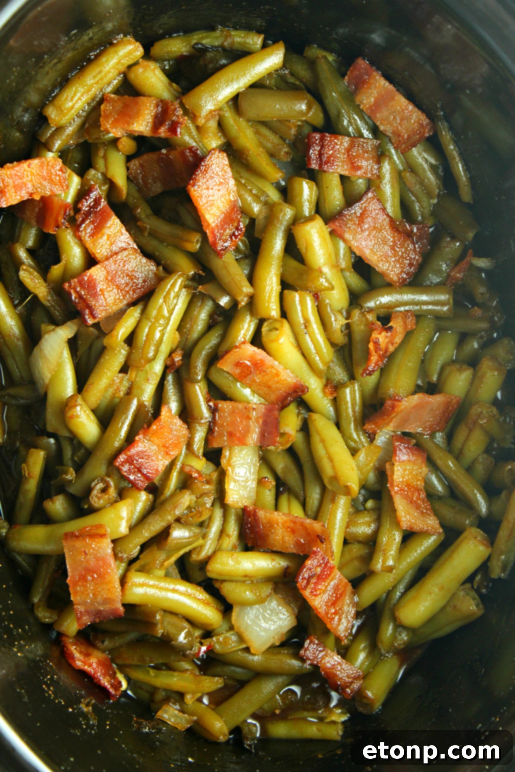 A bowl of the delicious Slow Cooker Buttery Bacon Green Beans, ready to eat