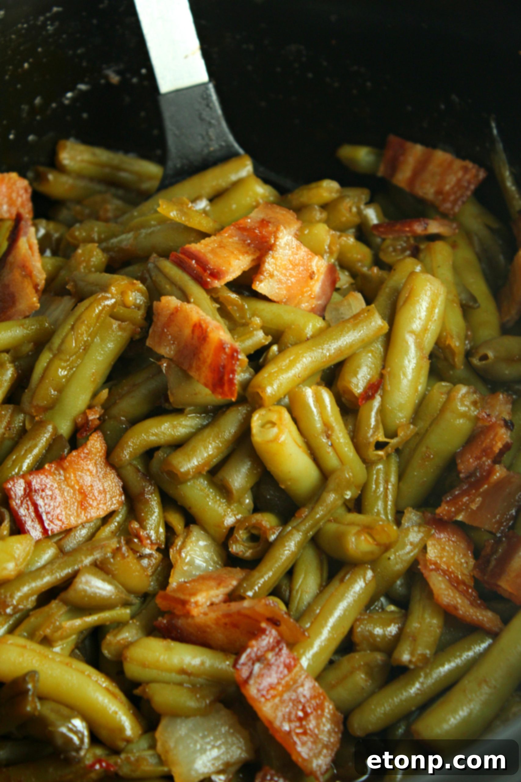 Slow Cooker Buttery Bacon Green Beans, perfectly cooked and topped with even more crispy bacon