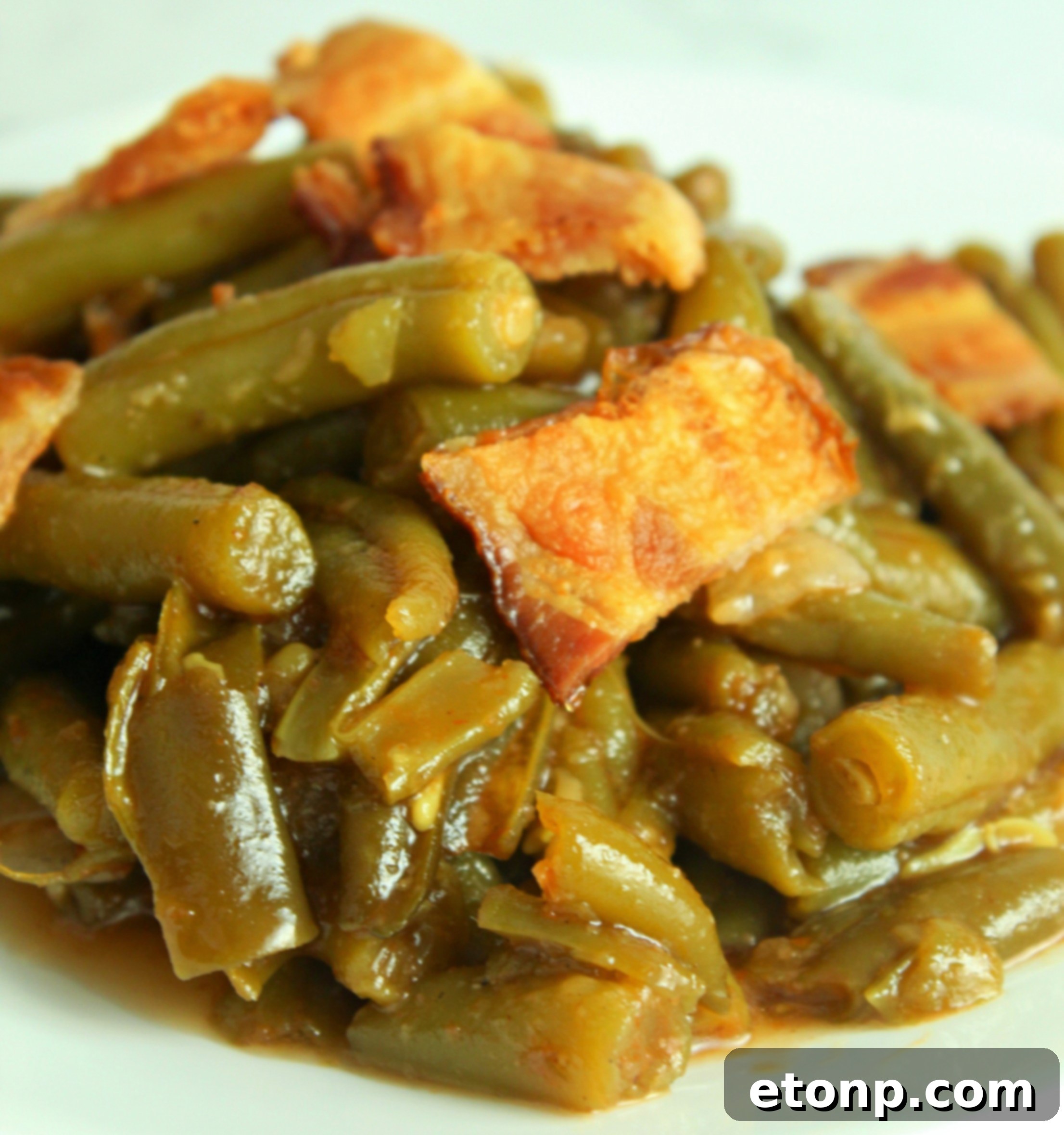 A delicious plate of Slow Cooker Buttery Bacon Green Beans, ready to be enjoyed