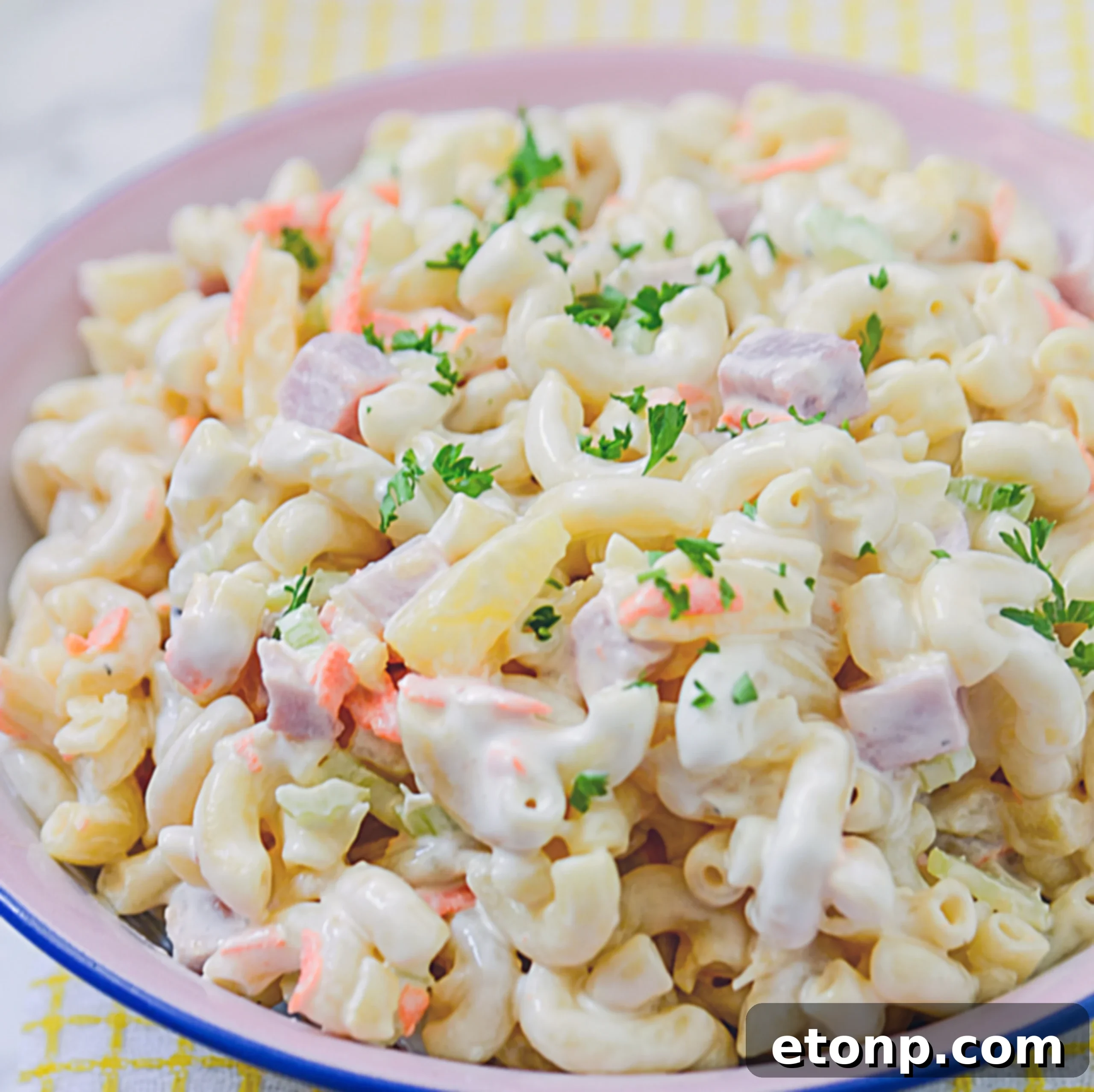 Island Macaroni Bliss 5 A large serving of Hawaiian Macaroni Salad, showcasing its rich texture.