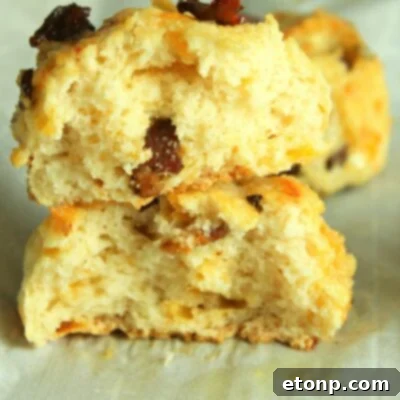 A top-down view of freshly baked Cheesy Bacon Garlic Biscuits, golden-brown and ready to eat.