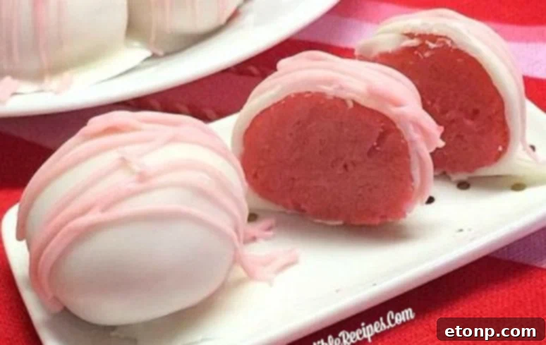 A tray of un-dipped strawberry cheesecake truffle balls chilling