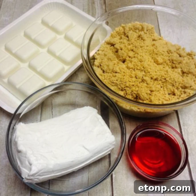 Strawberry cheesecake truffles with a pink drizzle on wax paper
