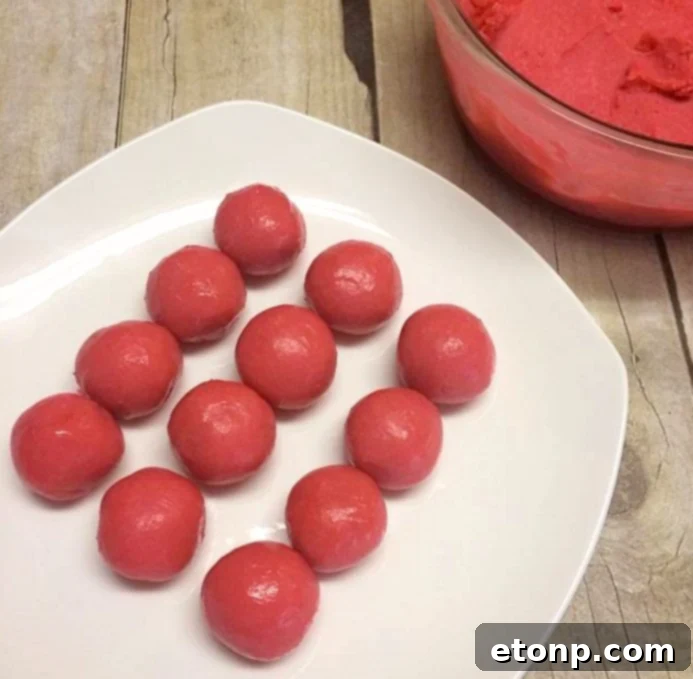 Assorted strawberry cheesecake truffles elegantly displayed