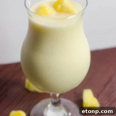 A vibrant Drunken Disney Dole Pineapple Whip Margarita, perfectly blended and ready to enjoy.