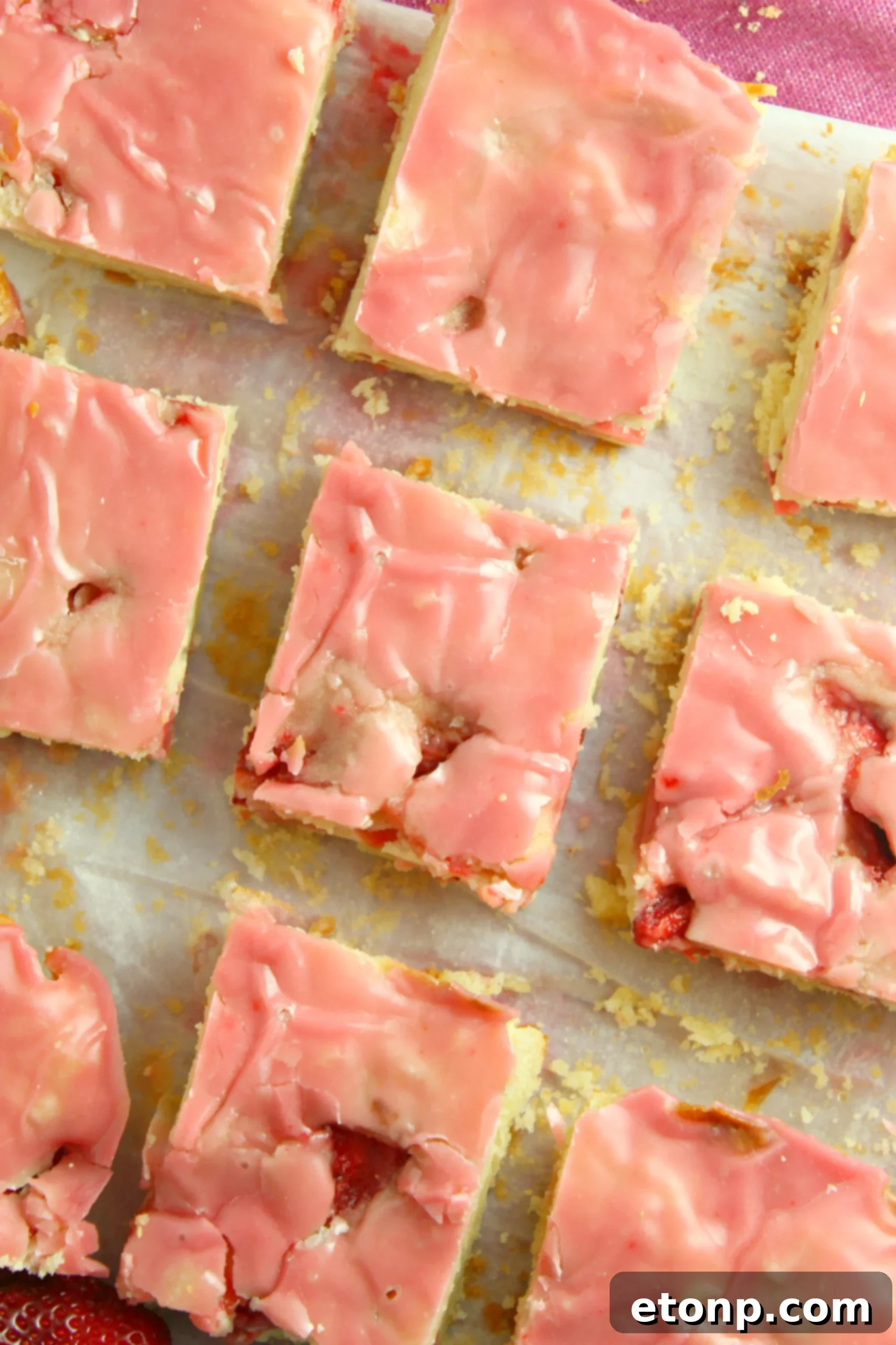 Homemade Strawberry Lemon Blondies 6 A baker's hands gently pressing the blondie batter into an 8x8 baking pan
