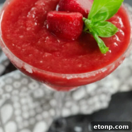 A vibrant Strawberry Daiquiri presented beautifully, highlighting the refreshing nature of the drink.