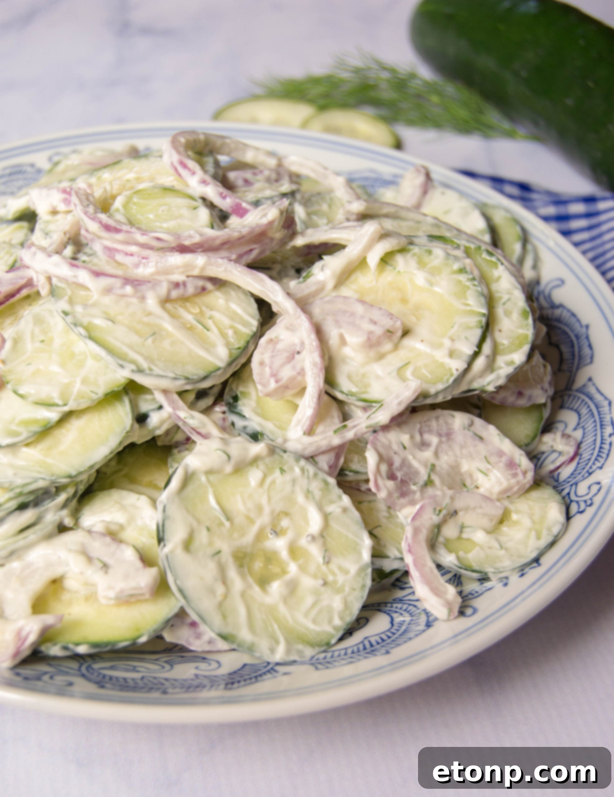 A bowl of creamy cucumber salad ready to be served
