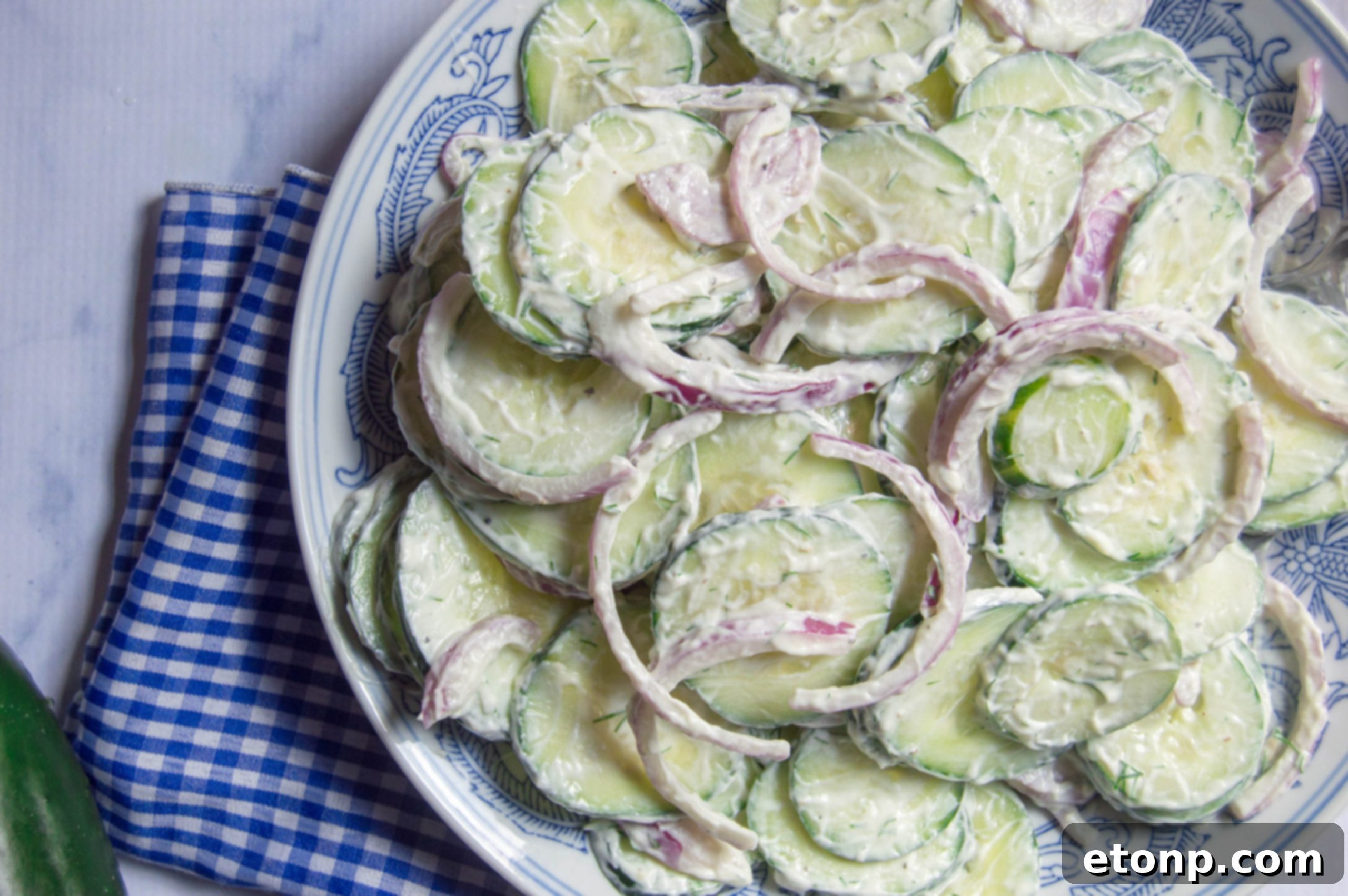 Creamy cucumber salad served in a elegant bowl