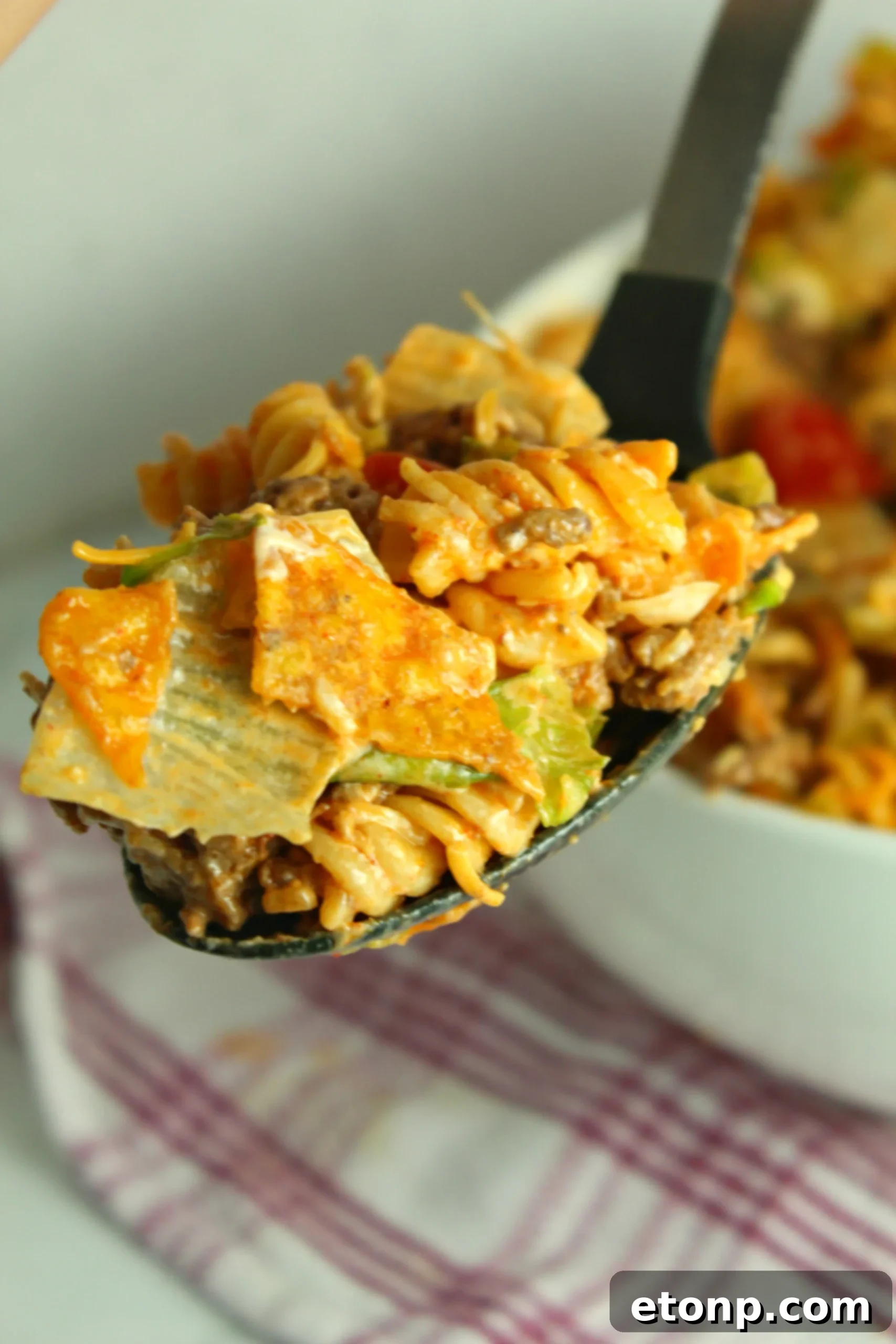 Doritos Locos Taco Pasta Salad presented in a large bowl, ready for a potluck or party, highlighting its suitability for gatherings.