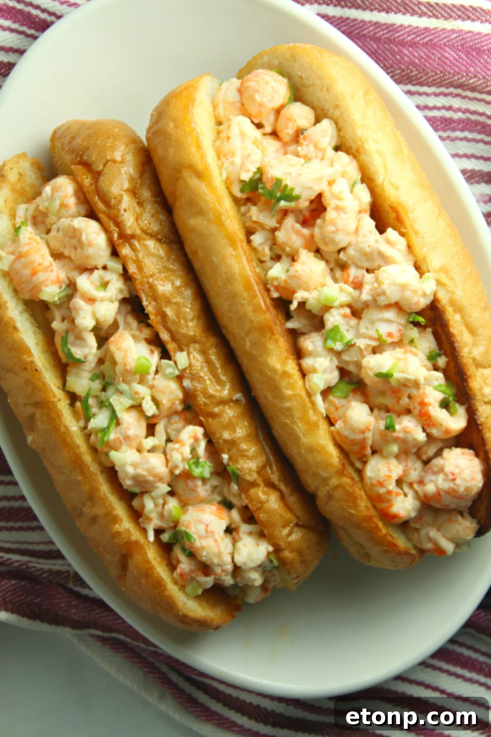 Another close-up of a lobster roll, highlighting the rich lobster meat