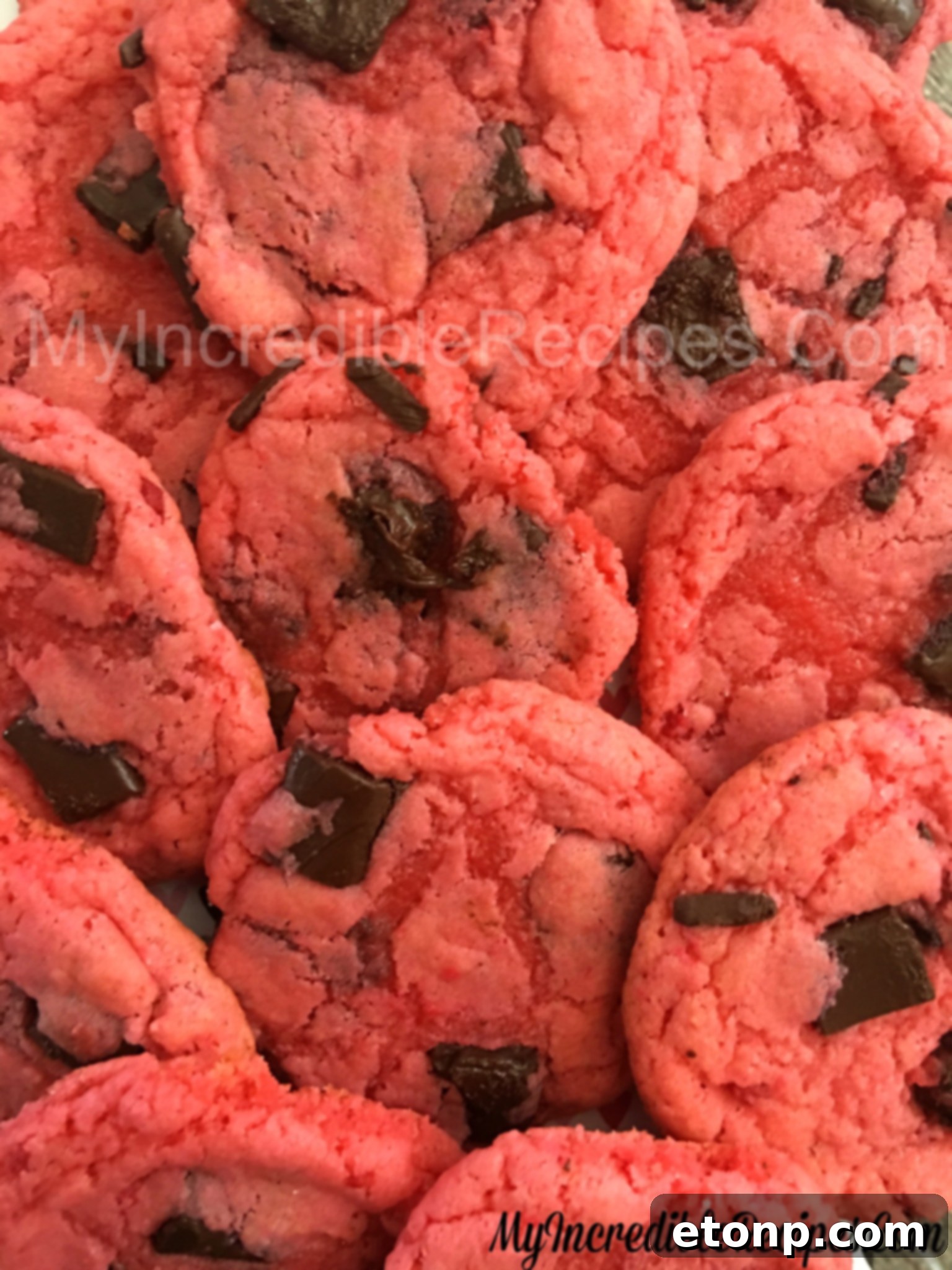 Close-up of a soft and chewy strawberry chocolate chunk cookie