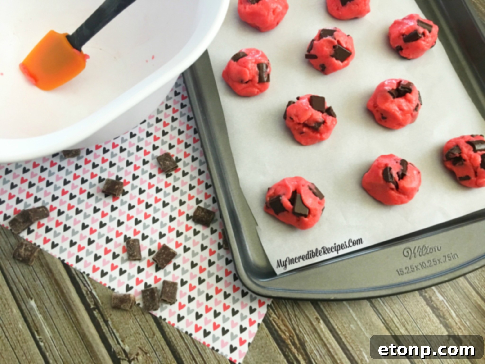 Strawberry cookies generously studded with chocolate chunks