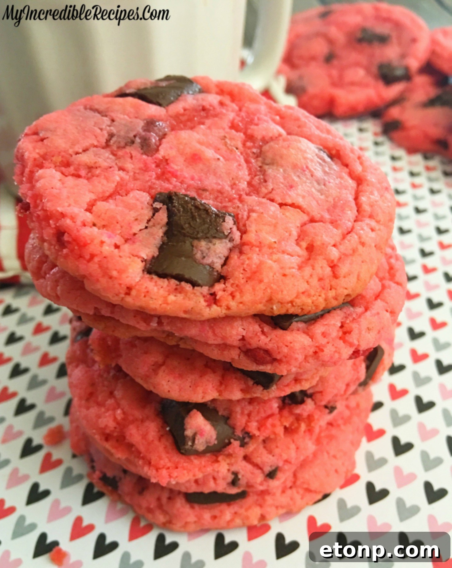 Someone enjoying a strawberry hot chocolate cookie with coffee