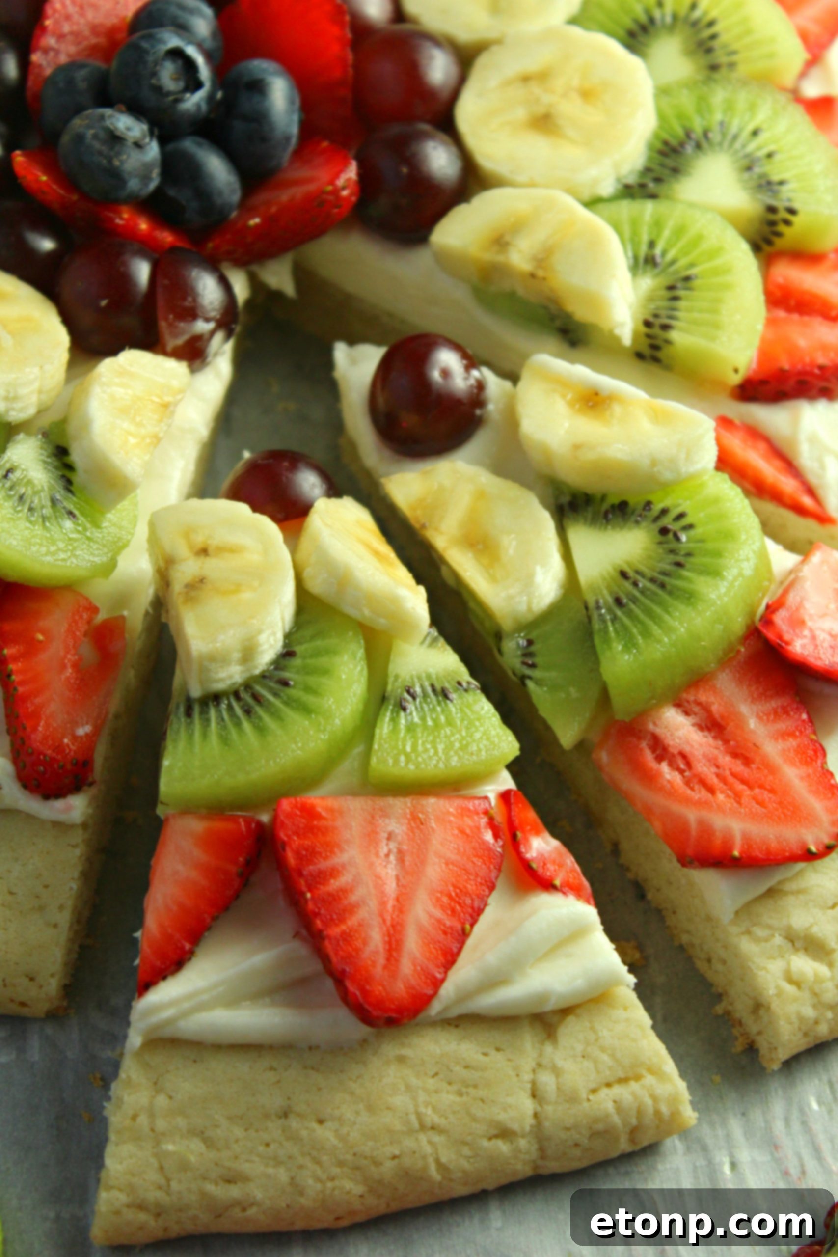Individual fruit pizza cookies, showing smaller portions of the dessert, perfect for bite-sized treats.