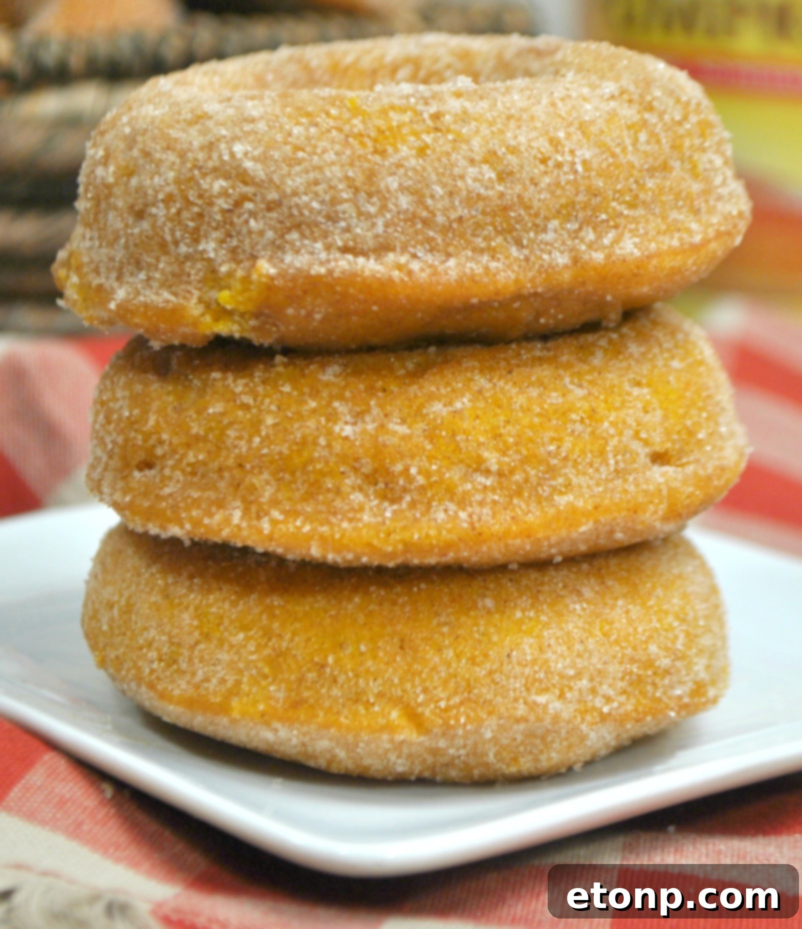 Assortment of pumpkin spice donuts on a festive autumn plate