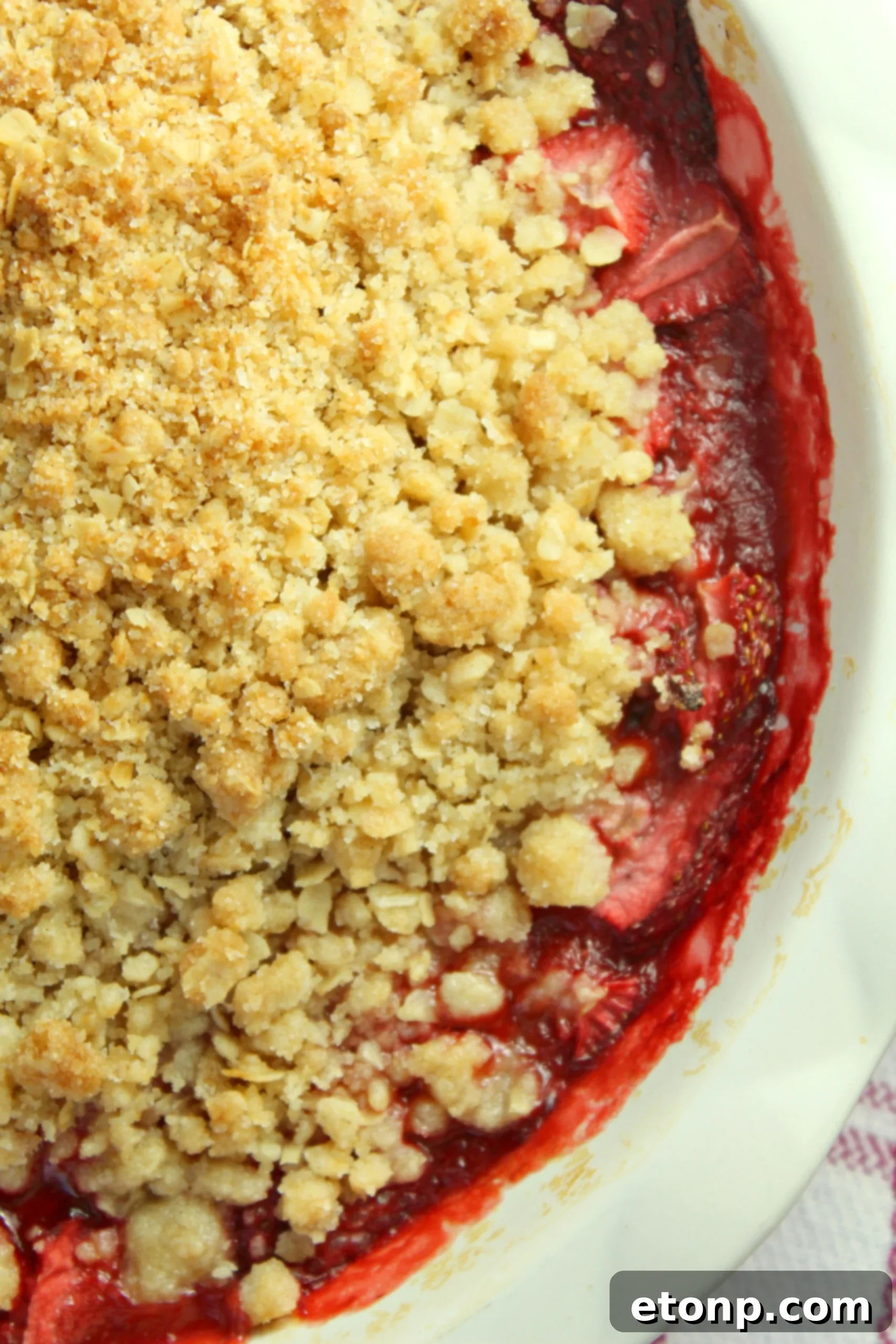 Scoop of Fresh Strawberry Crisp with ice cream