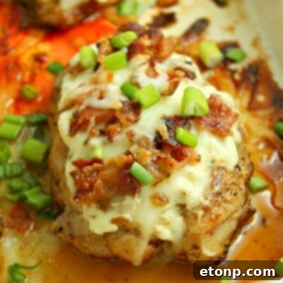 Smothered Crack Chicken recipe image with melted cheese, bacon, and scallions