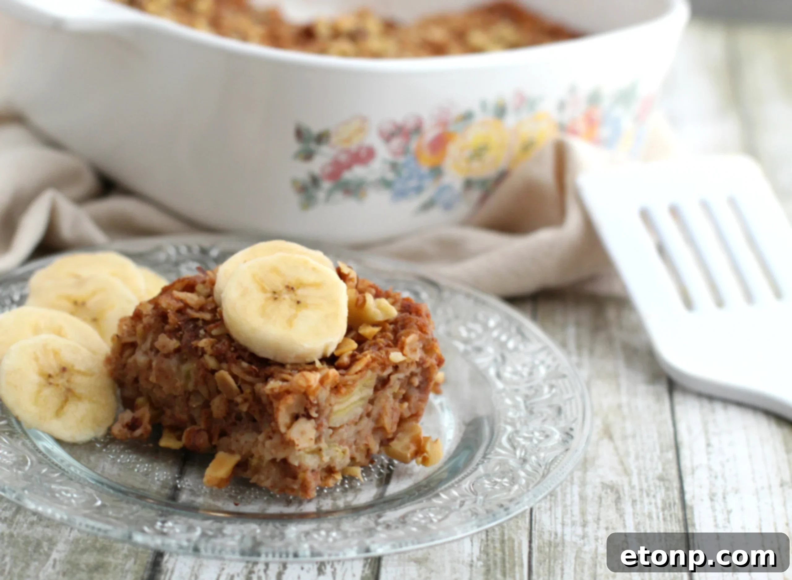 Chewy Banana Bread Oatmeal Bars 5 Neatly arranged banana bread oatmeal bars, showcasing their golden-brown tops and inviting texture.