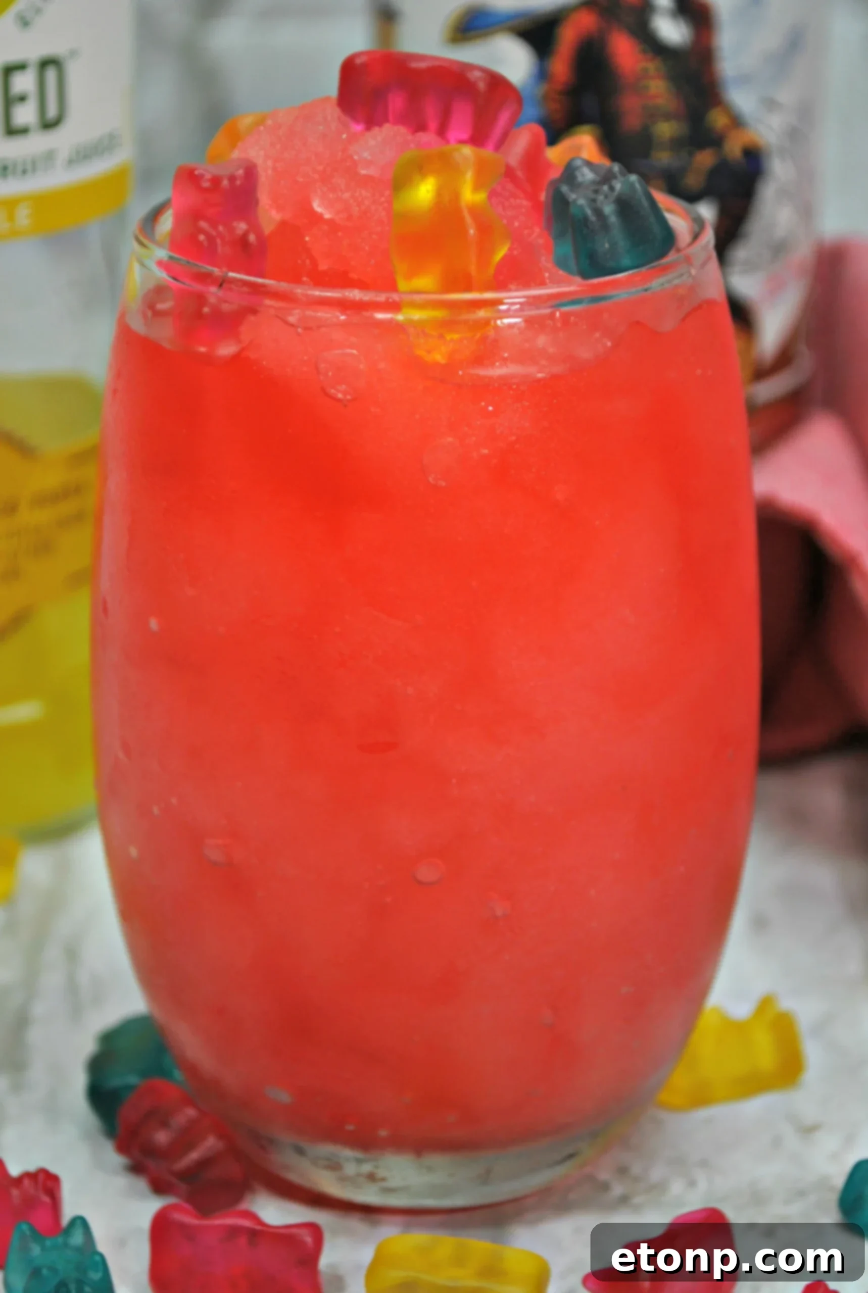 Drunken Gummy Bear Cocktail in a glass with colorful gummy bears