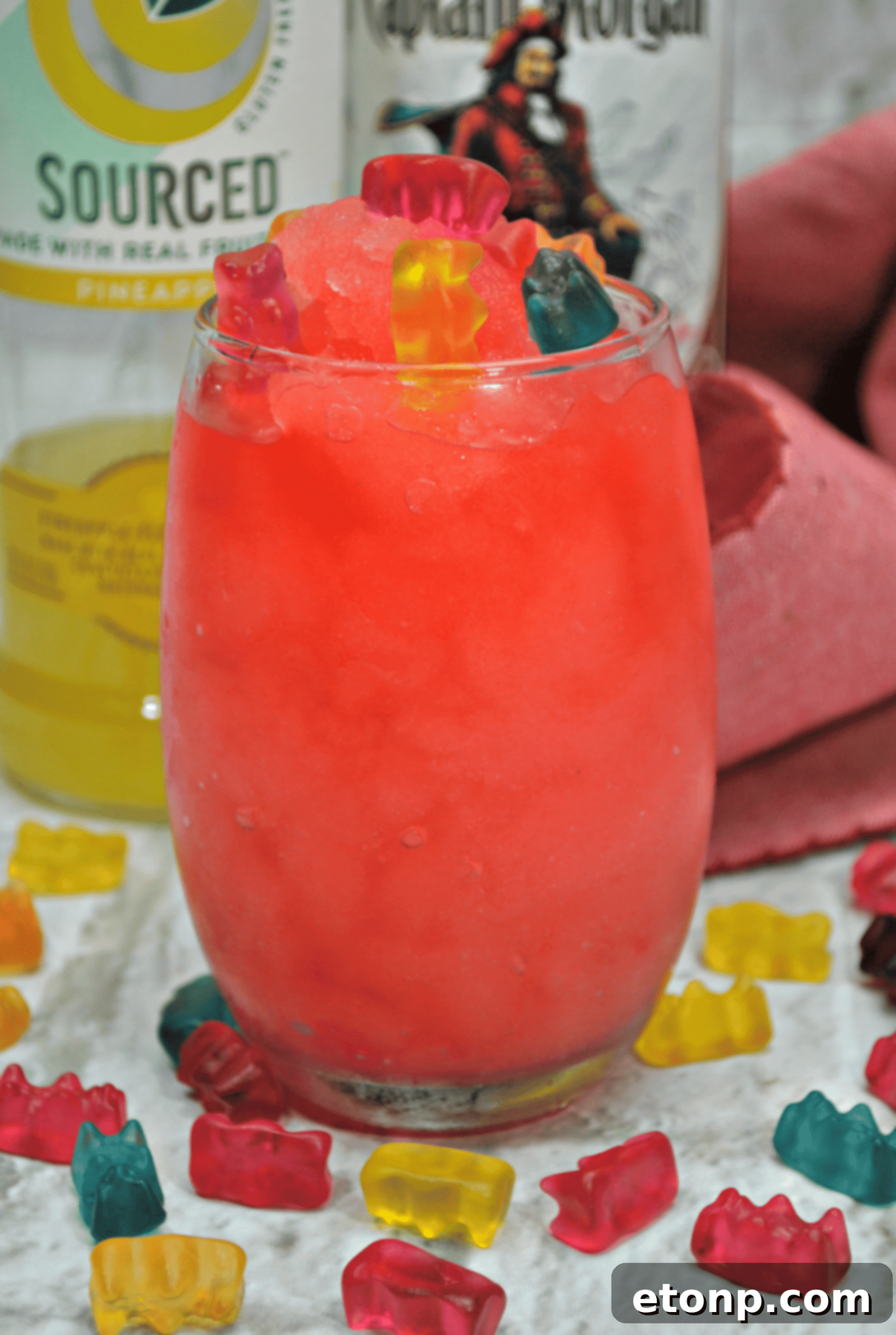 Close-up of a Drunken Gummy Bear Cocktail with a garnish of colorful gummy bears