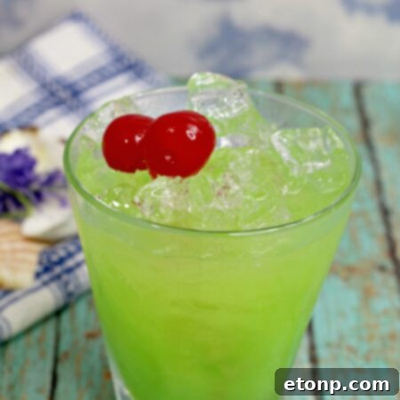 Emerald Iguana Elixir 6 Green Iguana Cocktail with a lime wedge