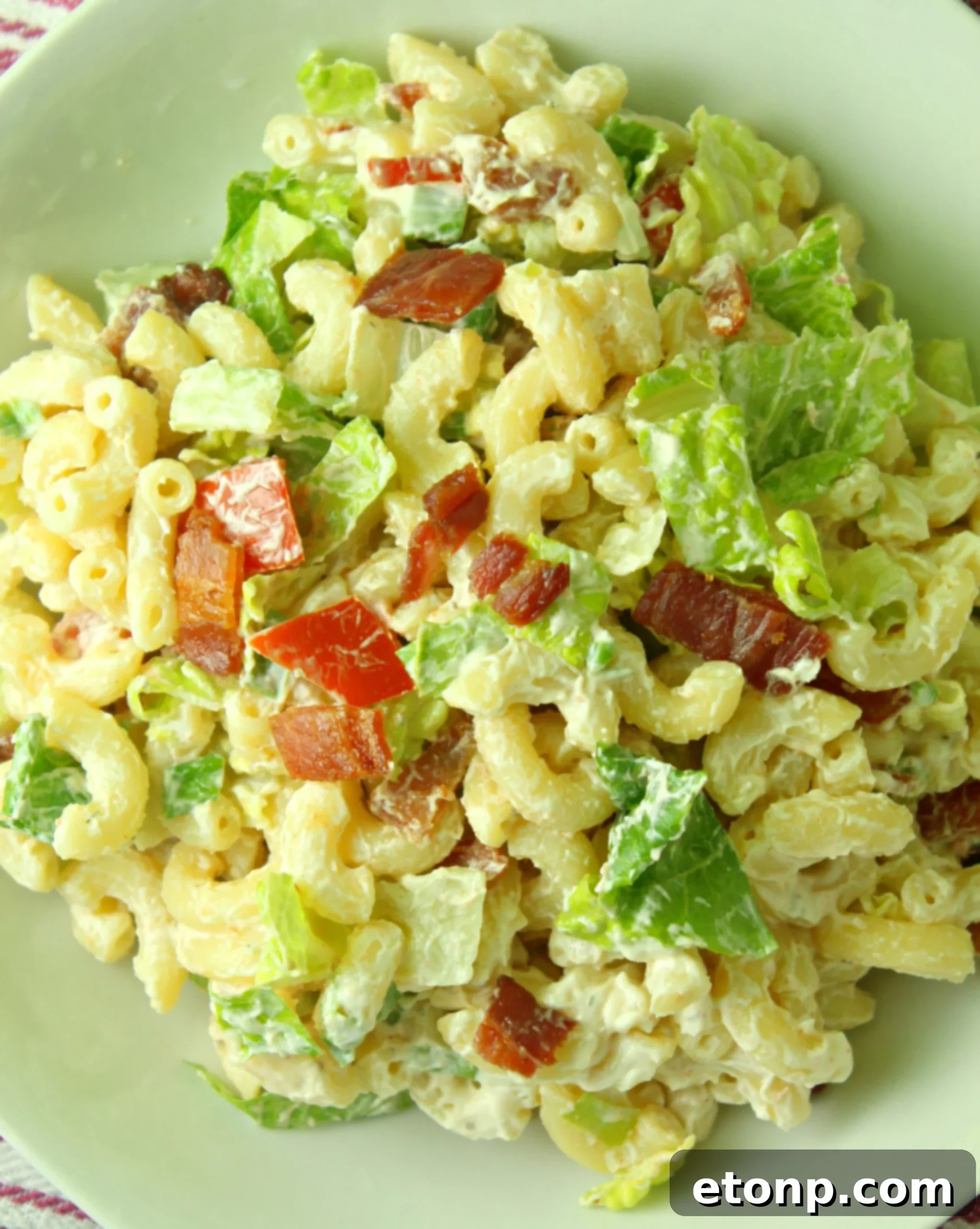 Loaded BLT Pasta Salad 7 Overhead shot of BLT Pasta Salad, highlighting the fresh romaine lettuce and crumbled bacon as key elements.