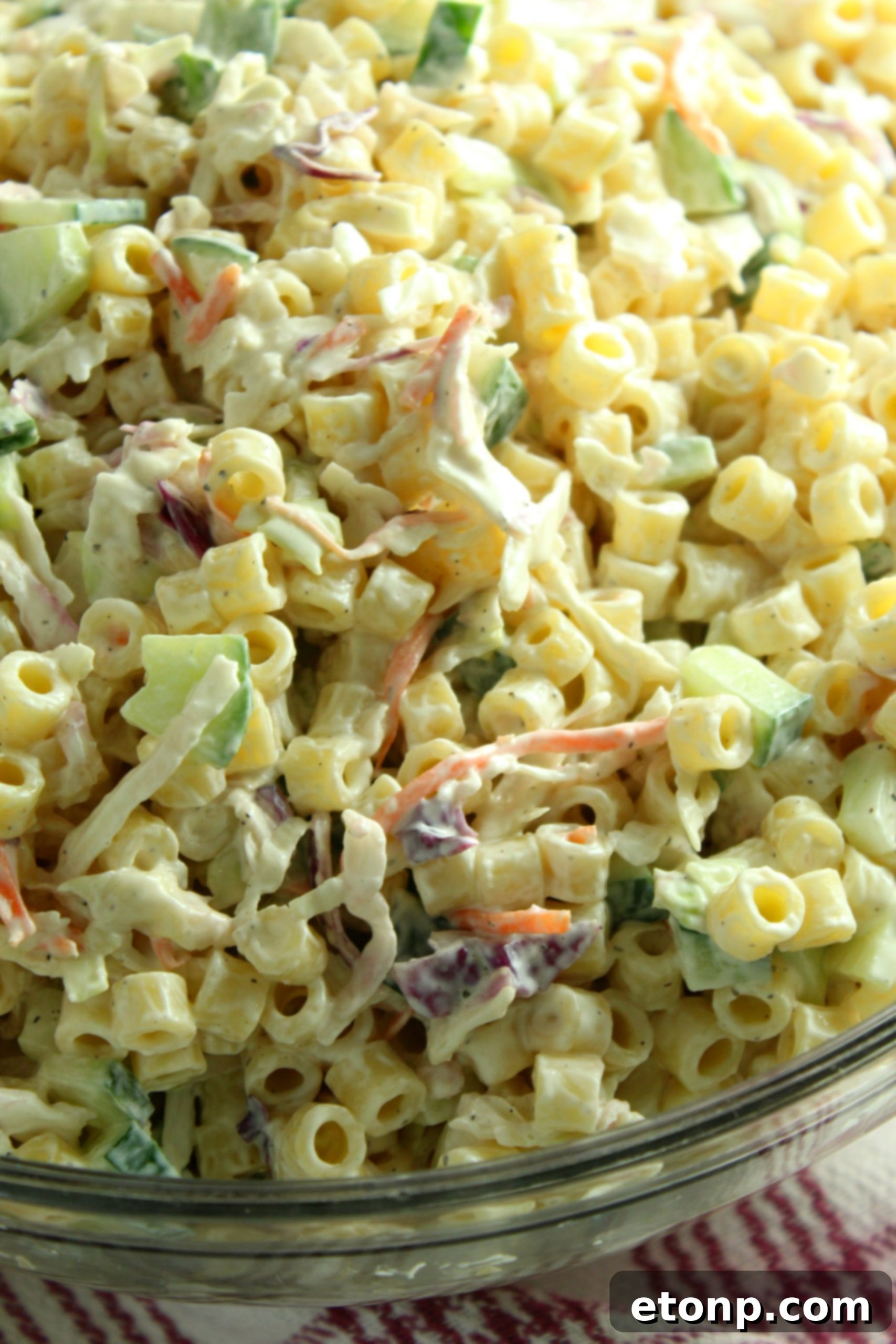 A freshly prepared bowl of Coleslaw Pasta Salad, ready to be chilled and enjoyed.