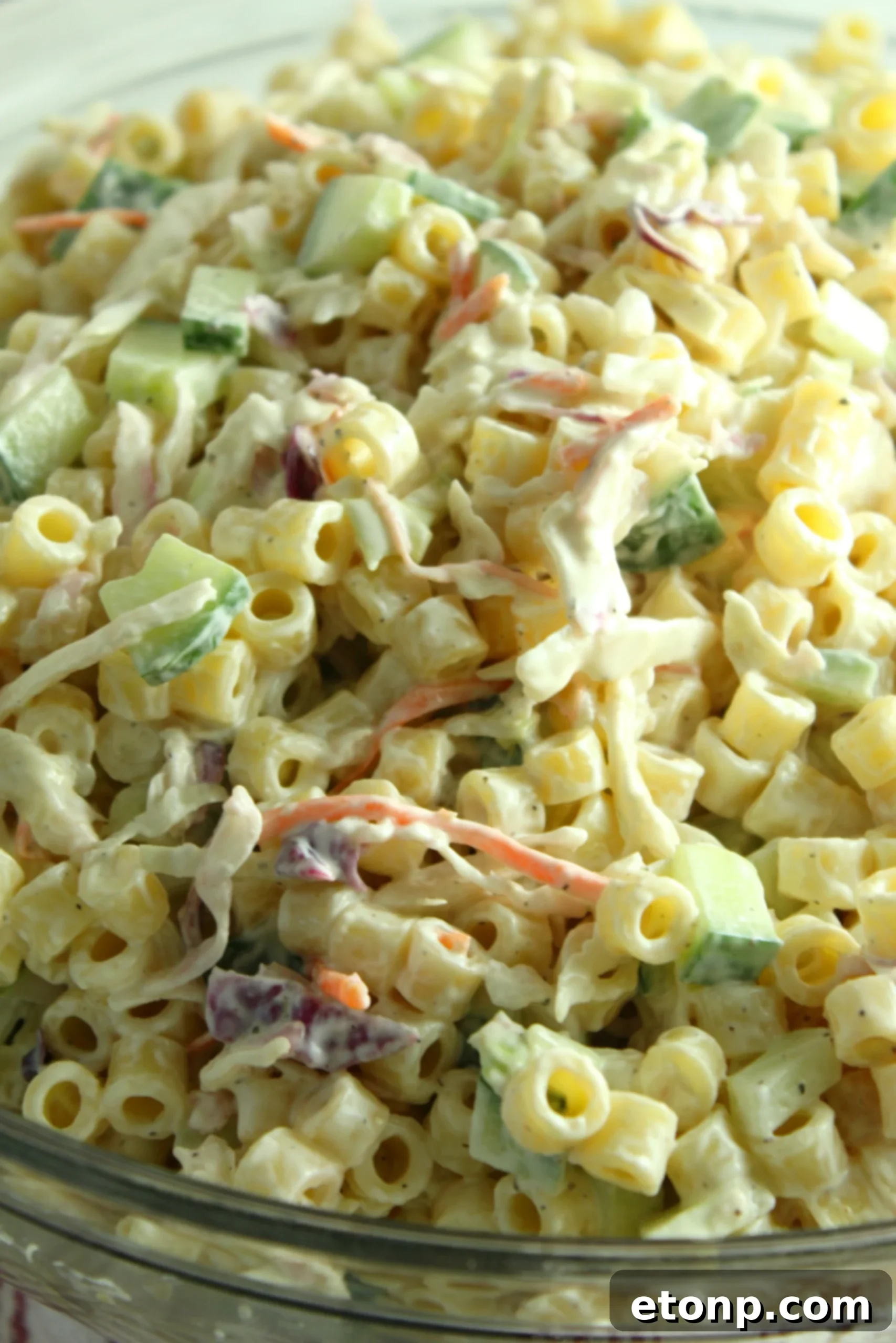 A full bowl of Coleslaw Pasta Salad, perfectly mixed and chilled, ready to be enjoyed as a summer side dish.